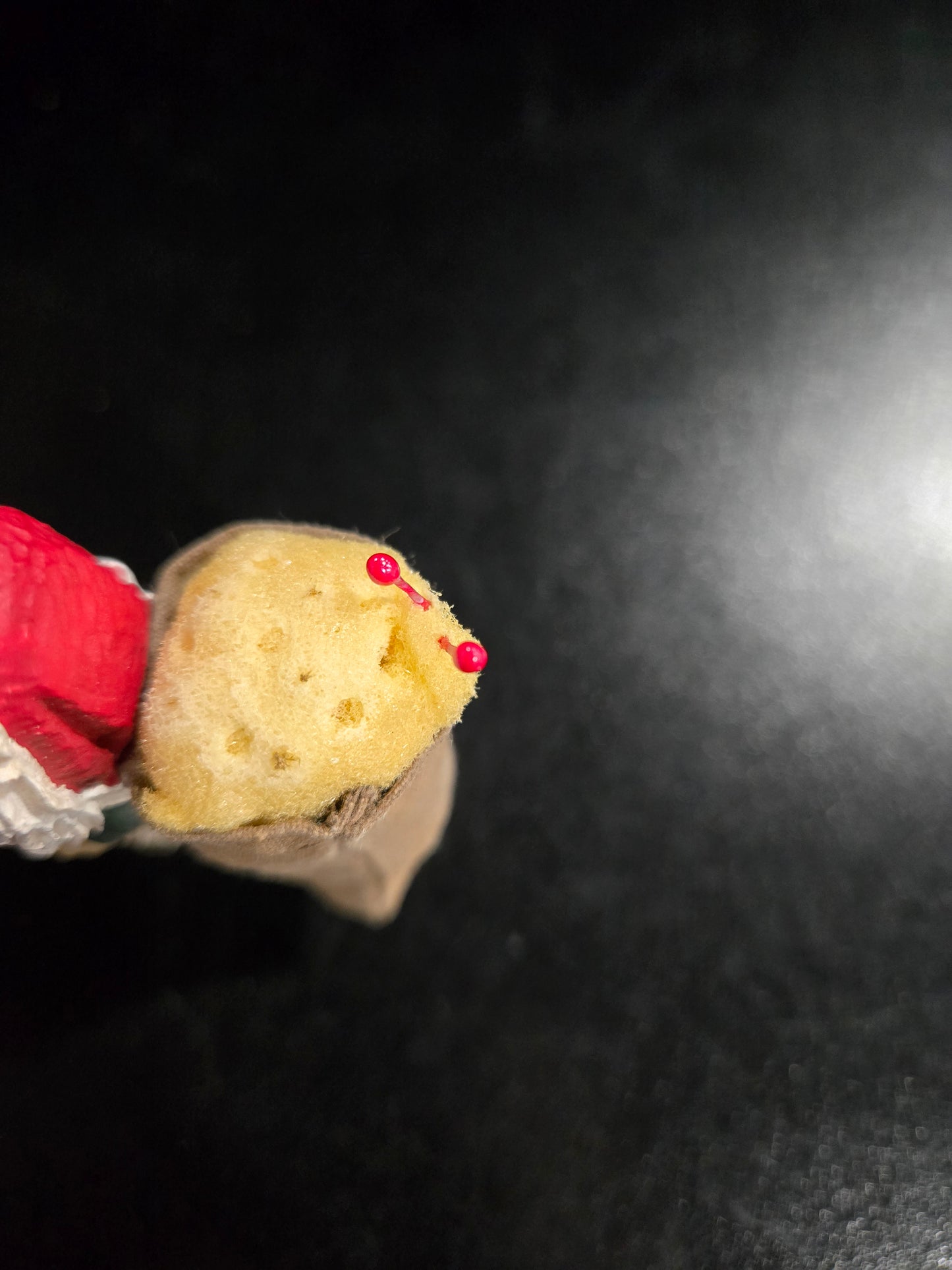 Resin Santa Claus holding big pin cushion