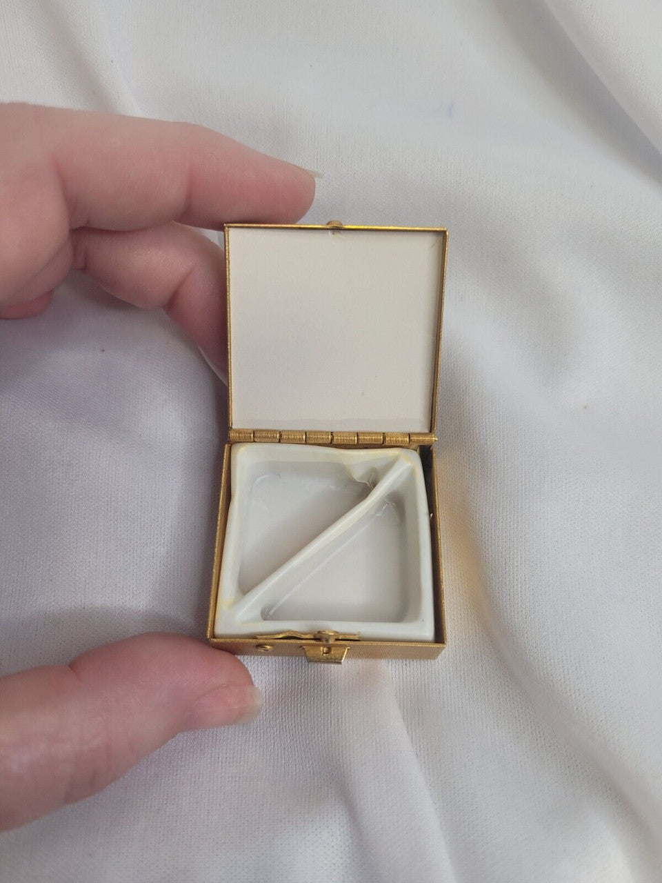 Small copper colored trinket box with gems