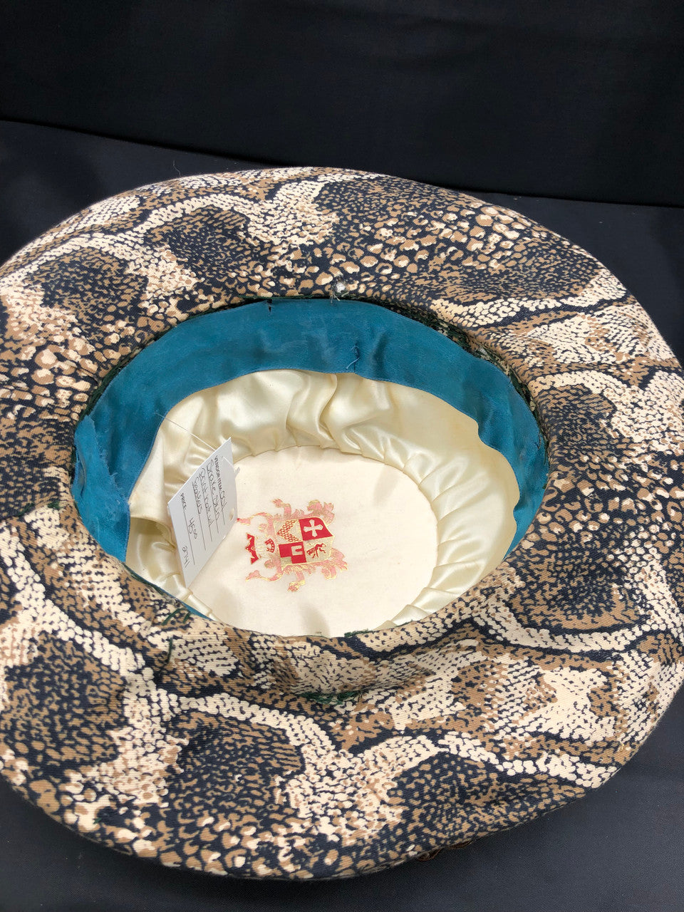 Snake skin print hat with feathers