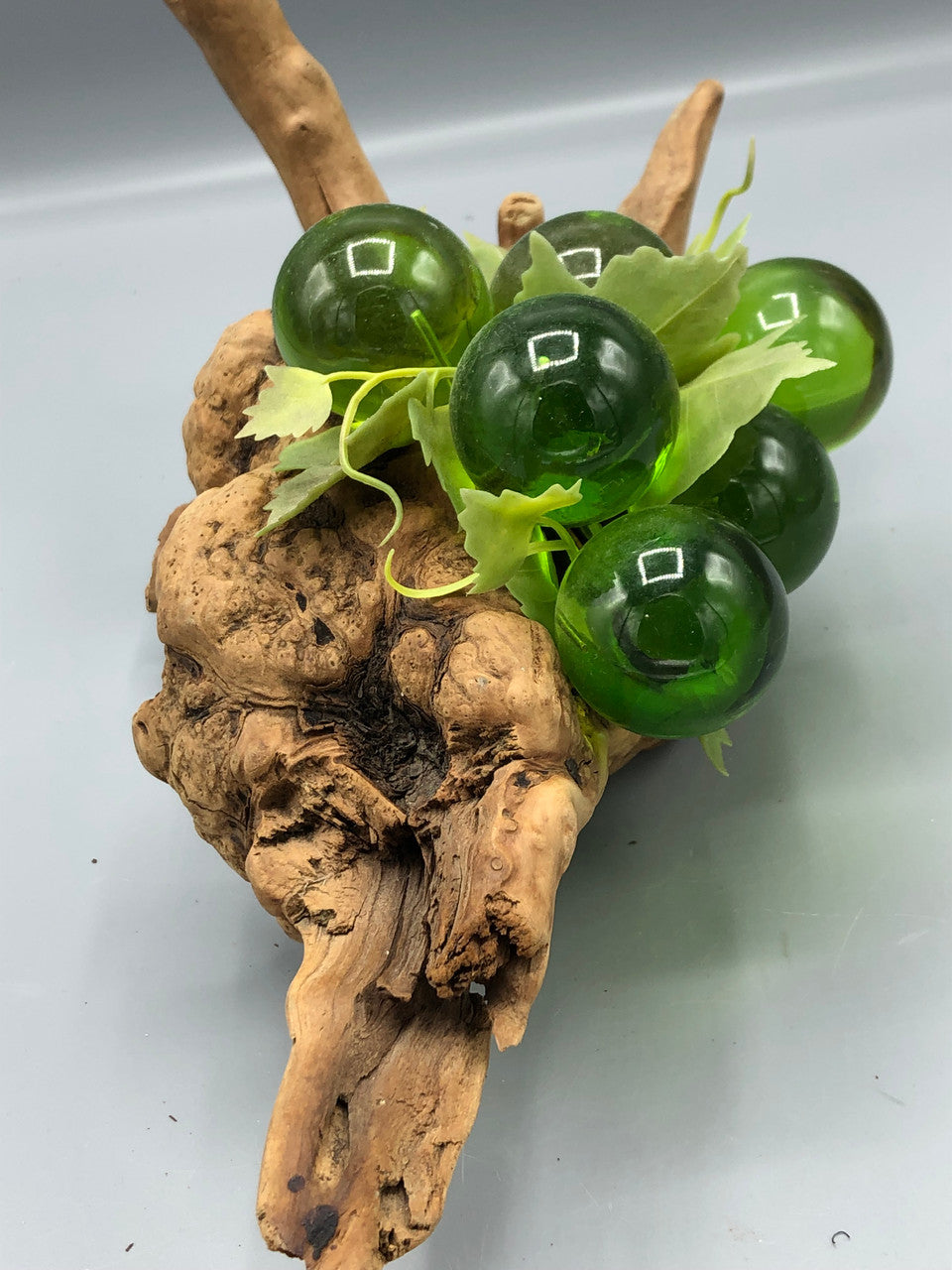 6 Cluster green grapes on wood