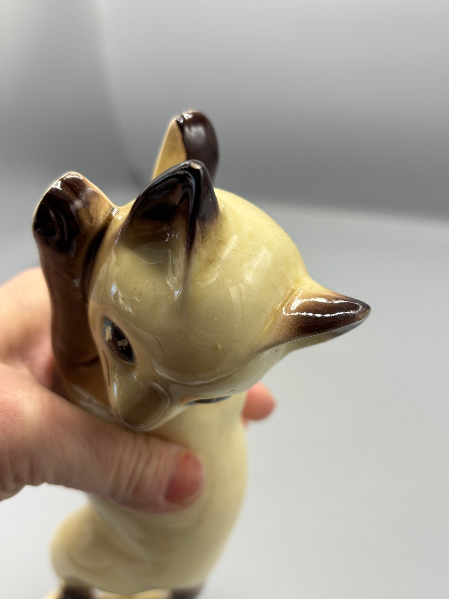 Vintage ceramic reclining Siamese cat