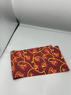 Red scarf with gold french horn design
