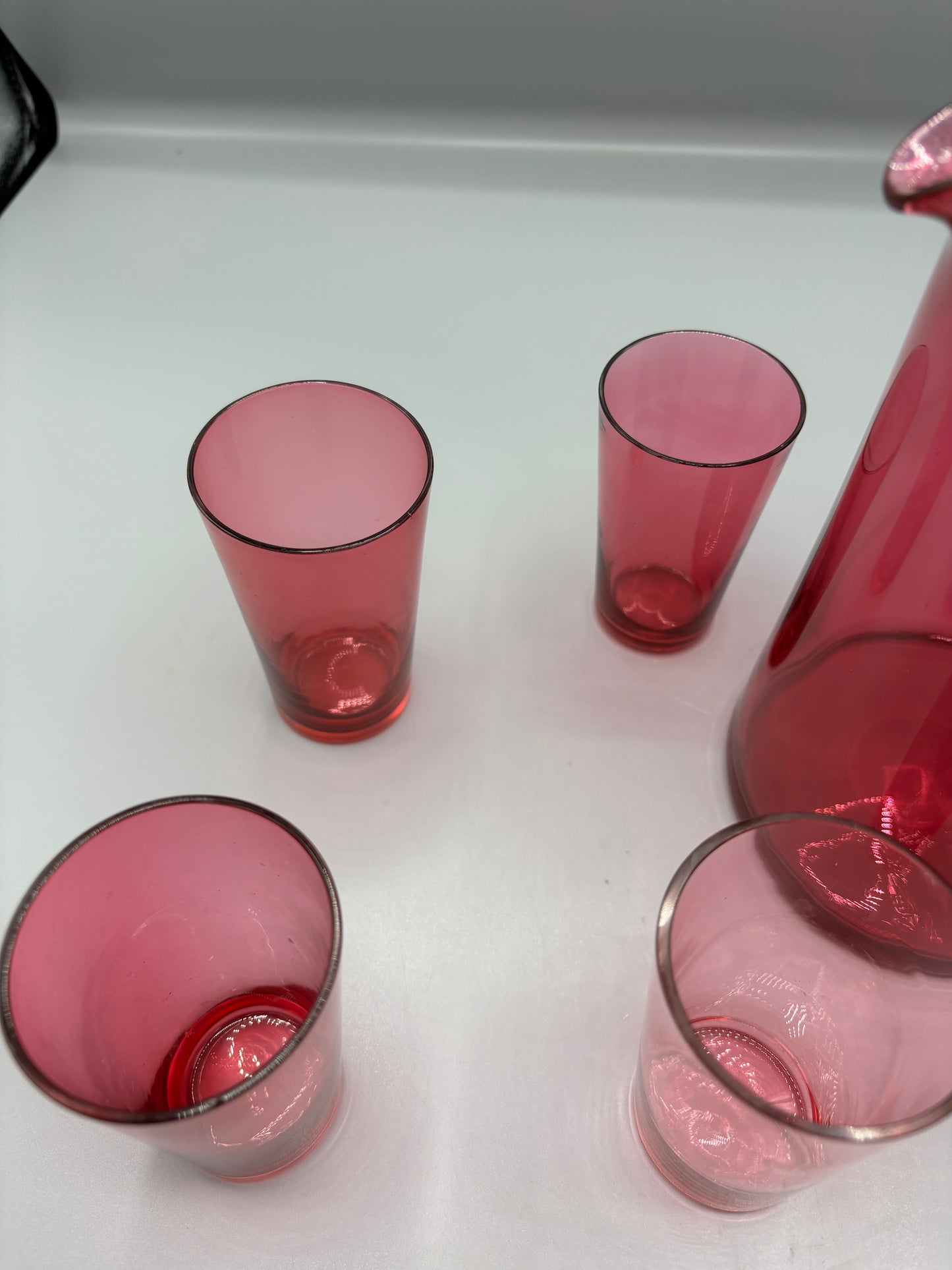 Vintage Cranberry glass pitcher with 4 handle cups