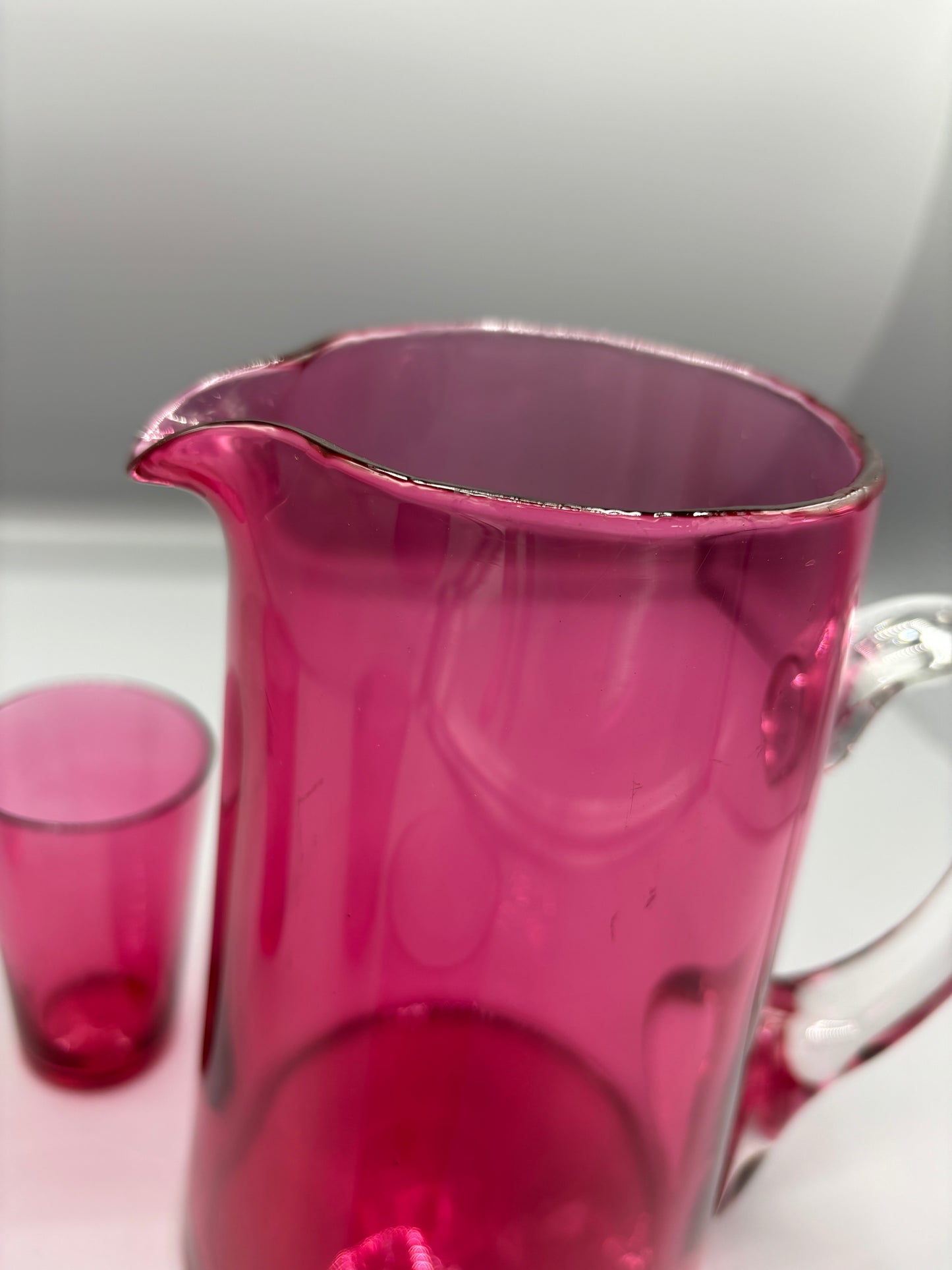 Vintage Cranberry glass pitcher with 4 handle cups