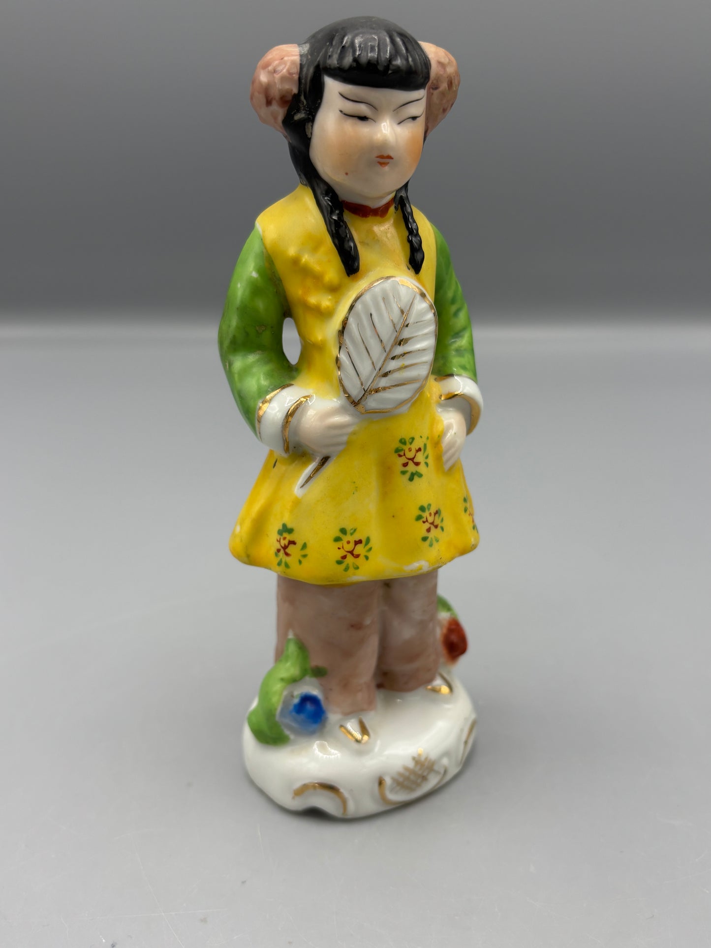 Vintage Japanese girl figure with braids