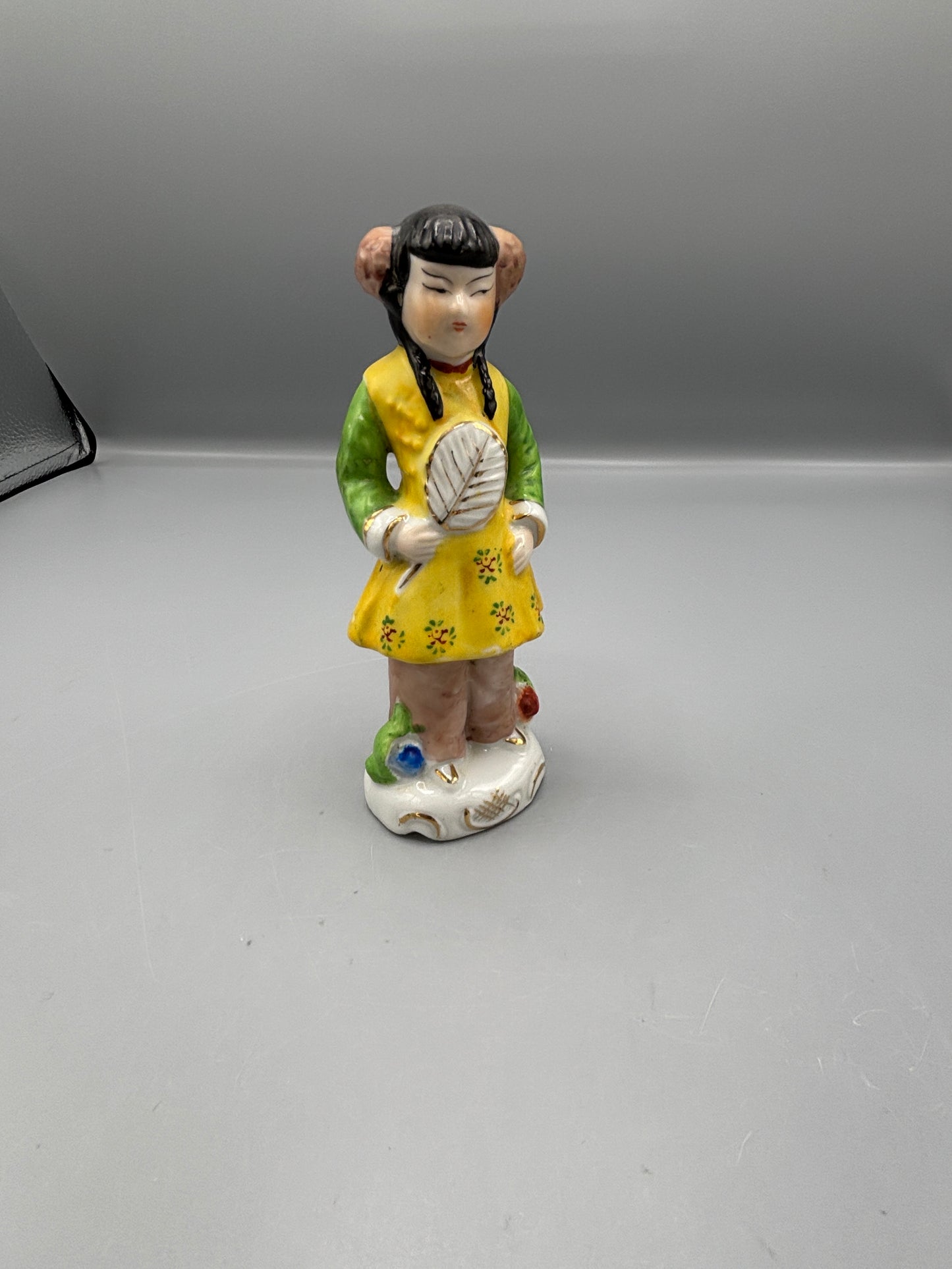 Vintage Japanese girl figure with braids