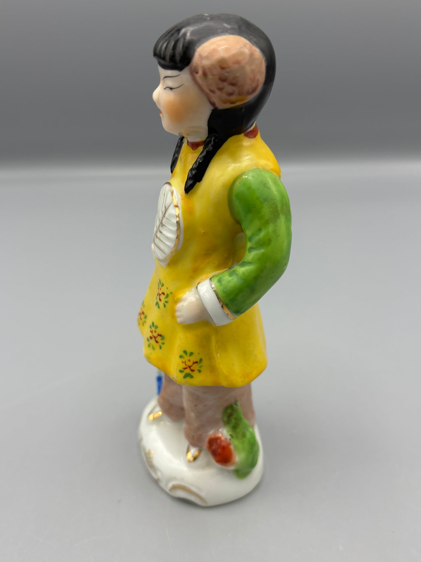 Vintage Japanese girl figure with braids
