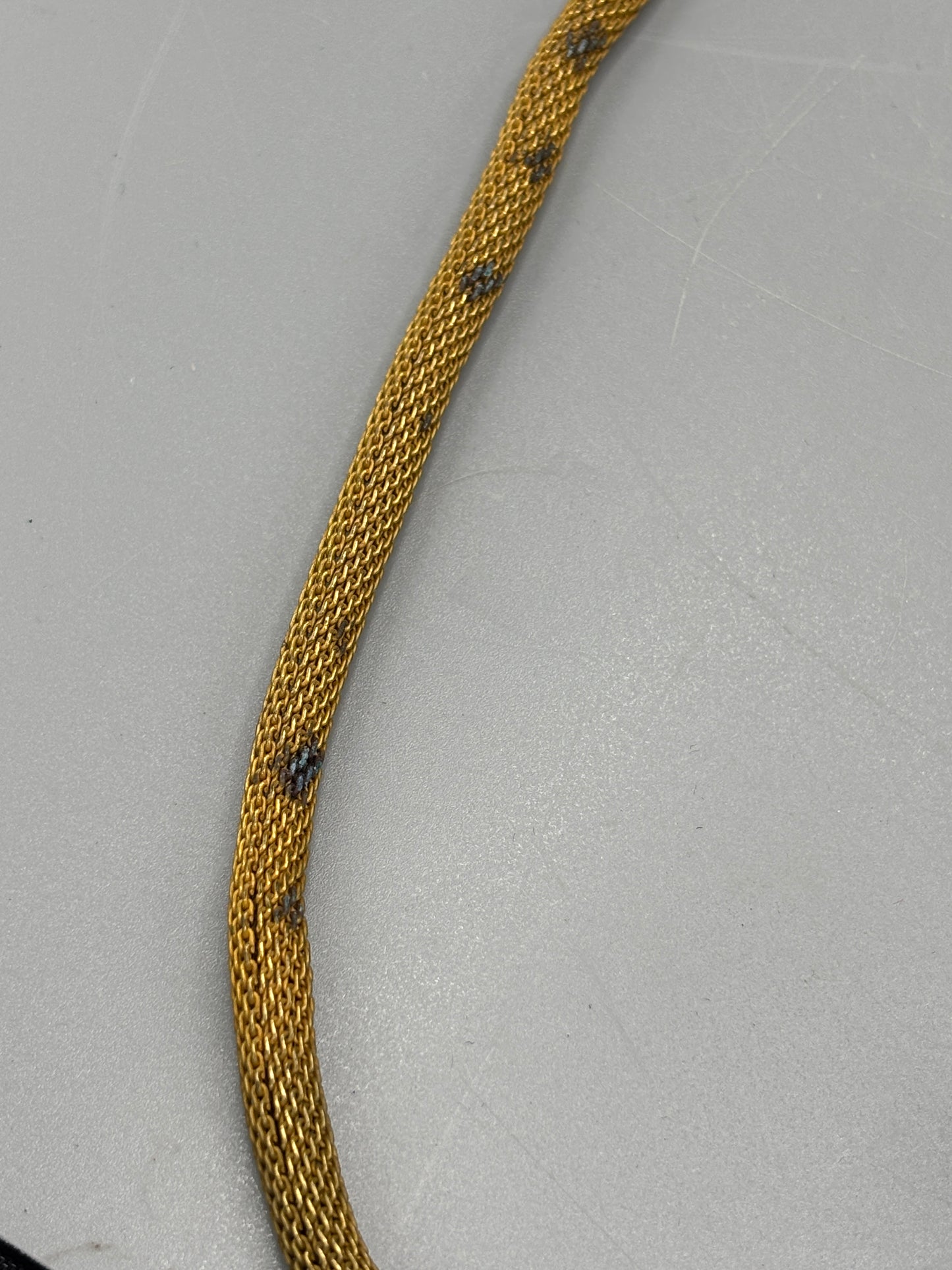 Miriam Haskell gold tone mesh with blue stone