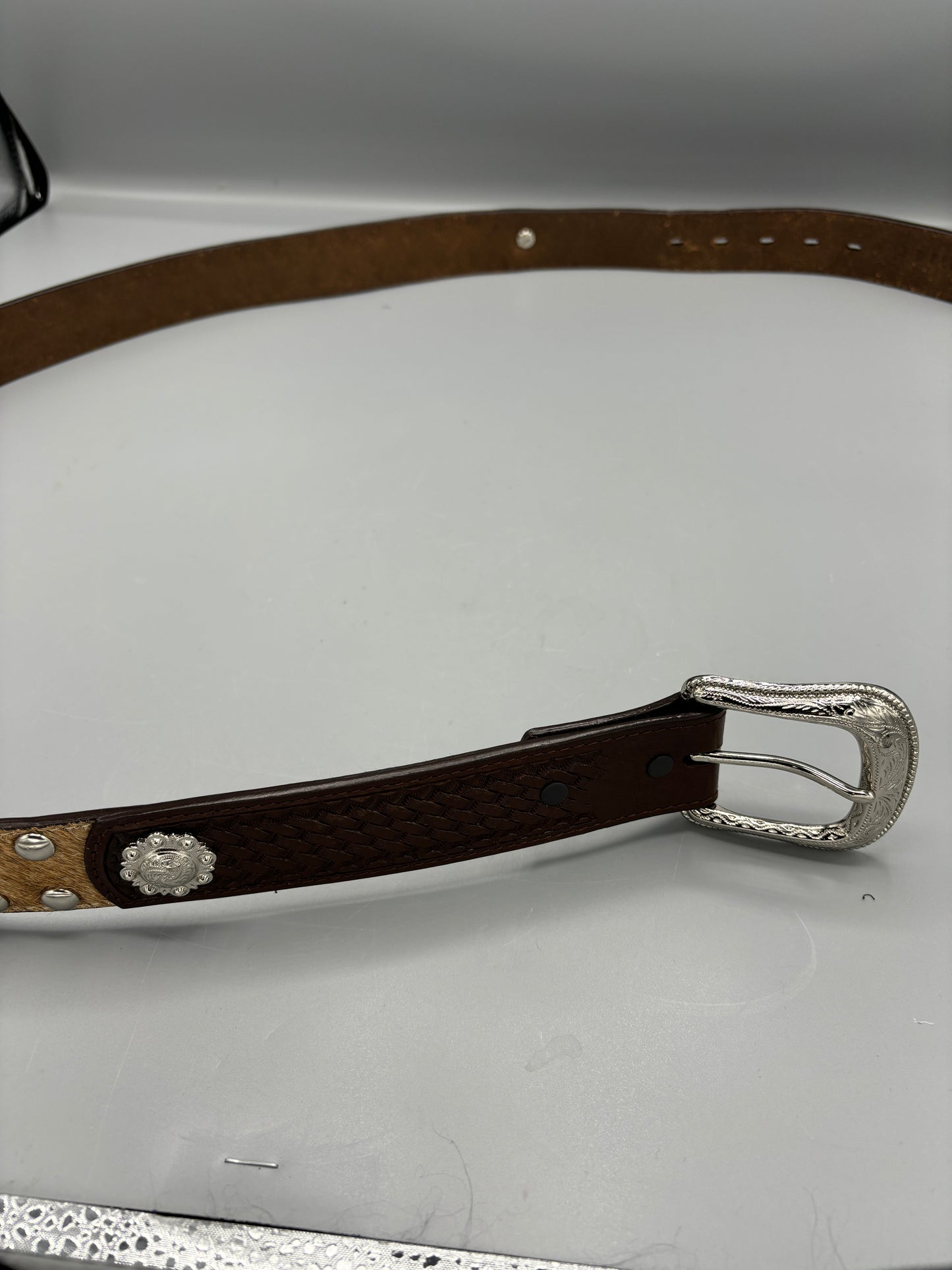 Hand tooled leather with fur belt