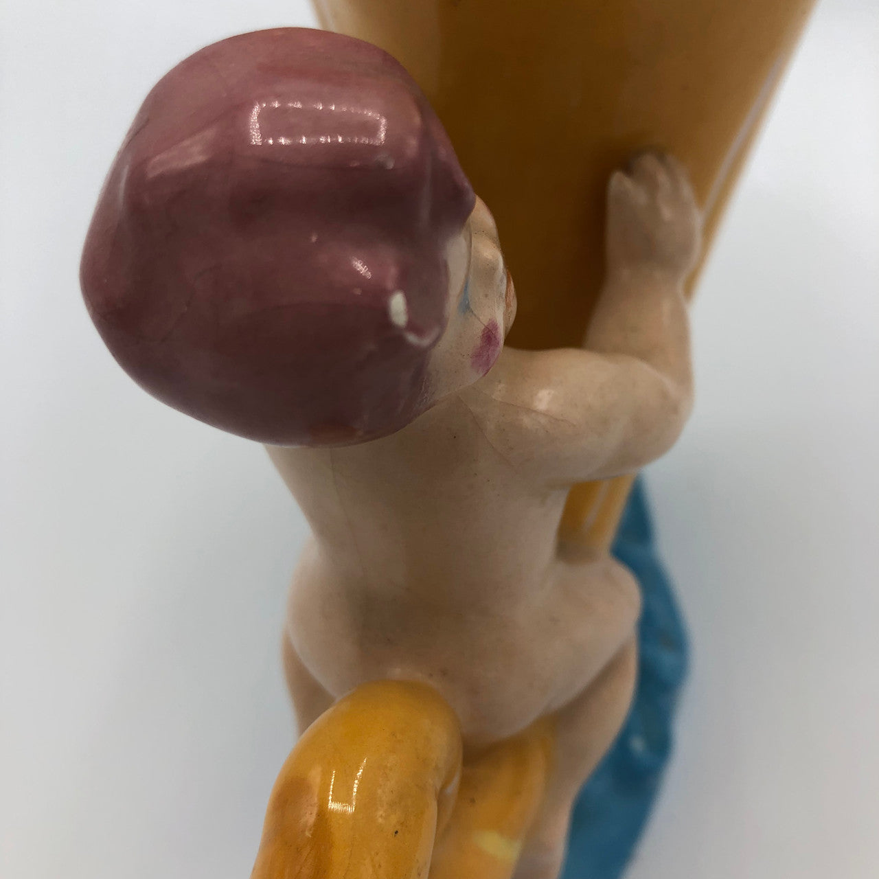 Baby riding a Cornucopia planter