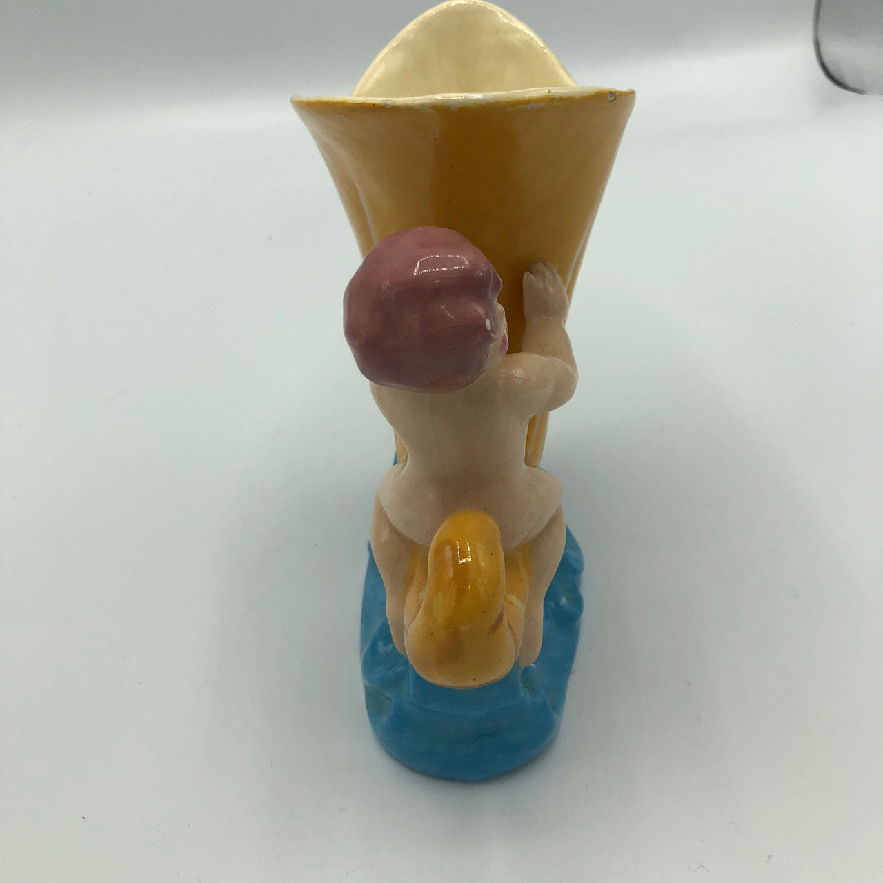 Baby riding a Cornucopia planter