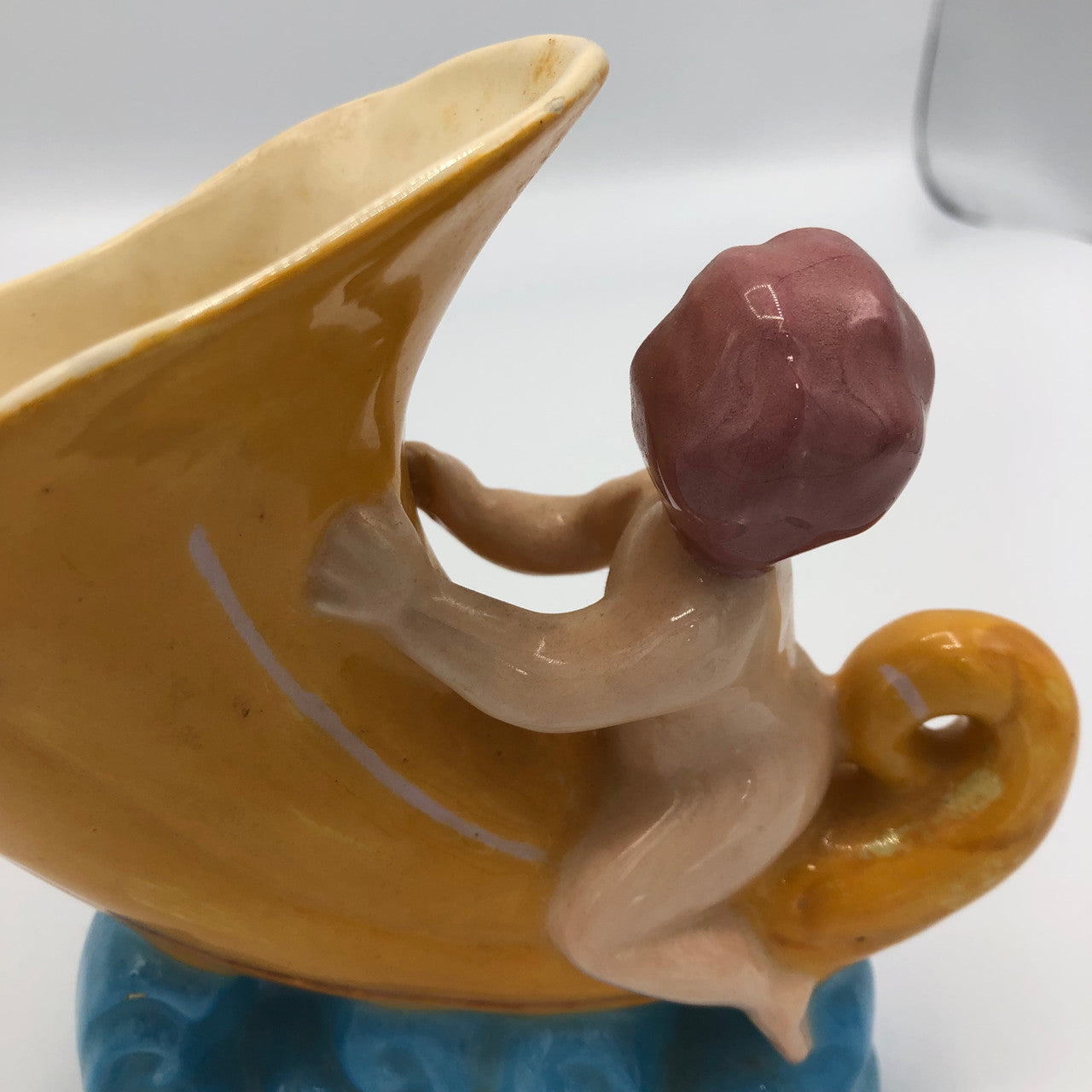 Baby riding a Cornucopia planter