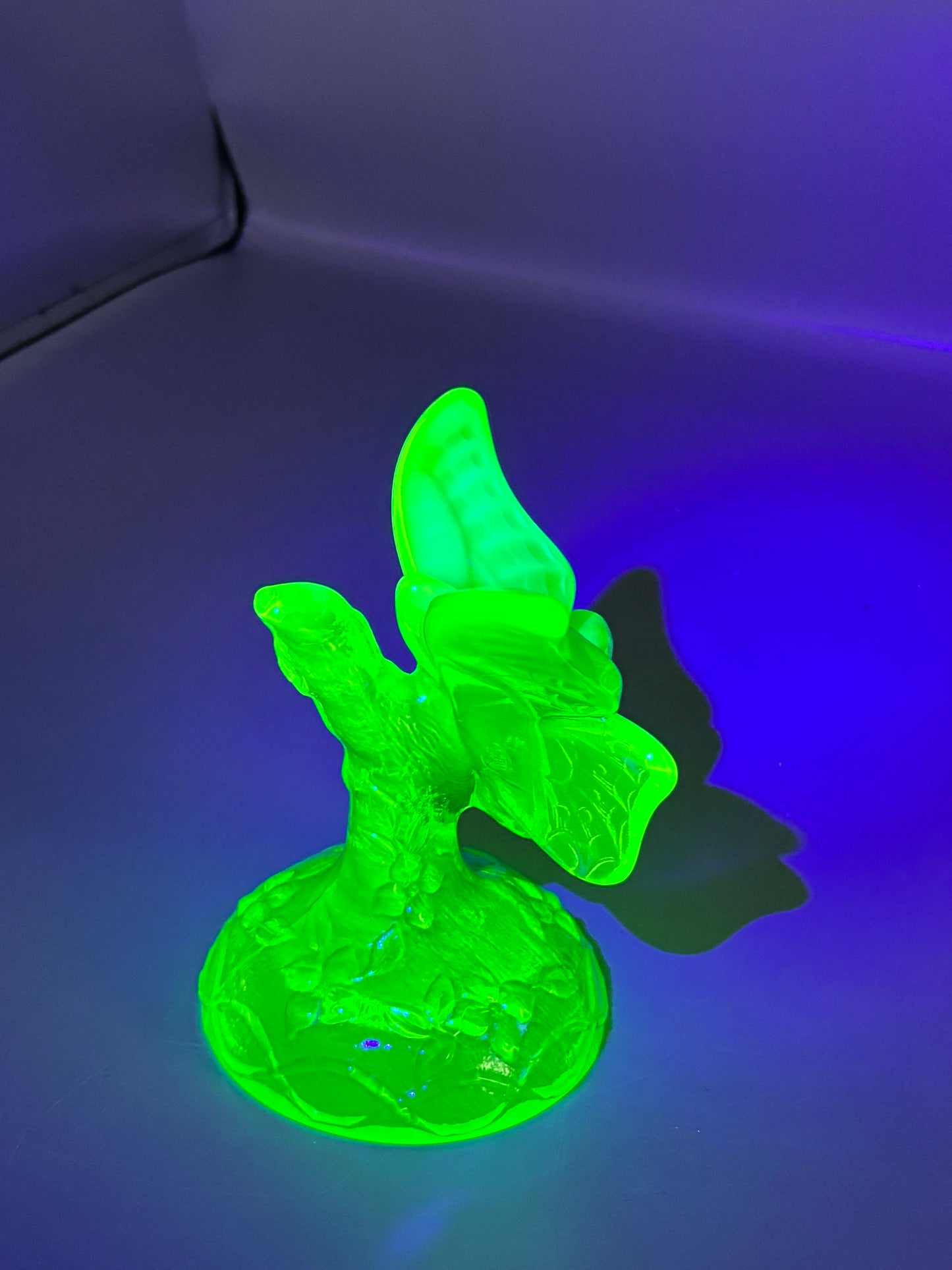 Vintage Fenton Uranium butterfly in a branch ring holder