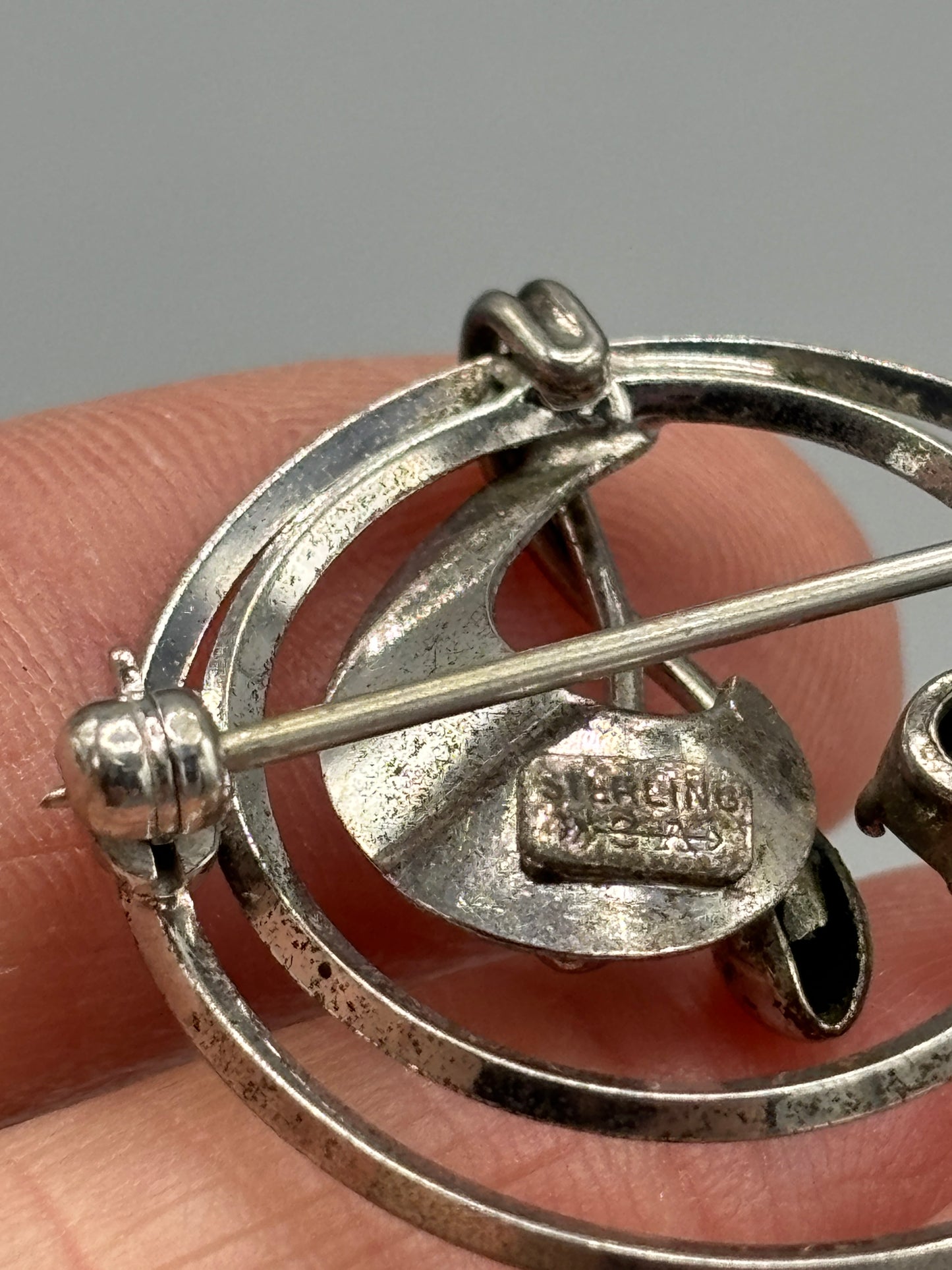 Vintage Sterling circle brooch with Garnet stone