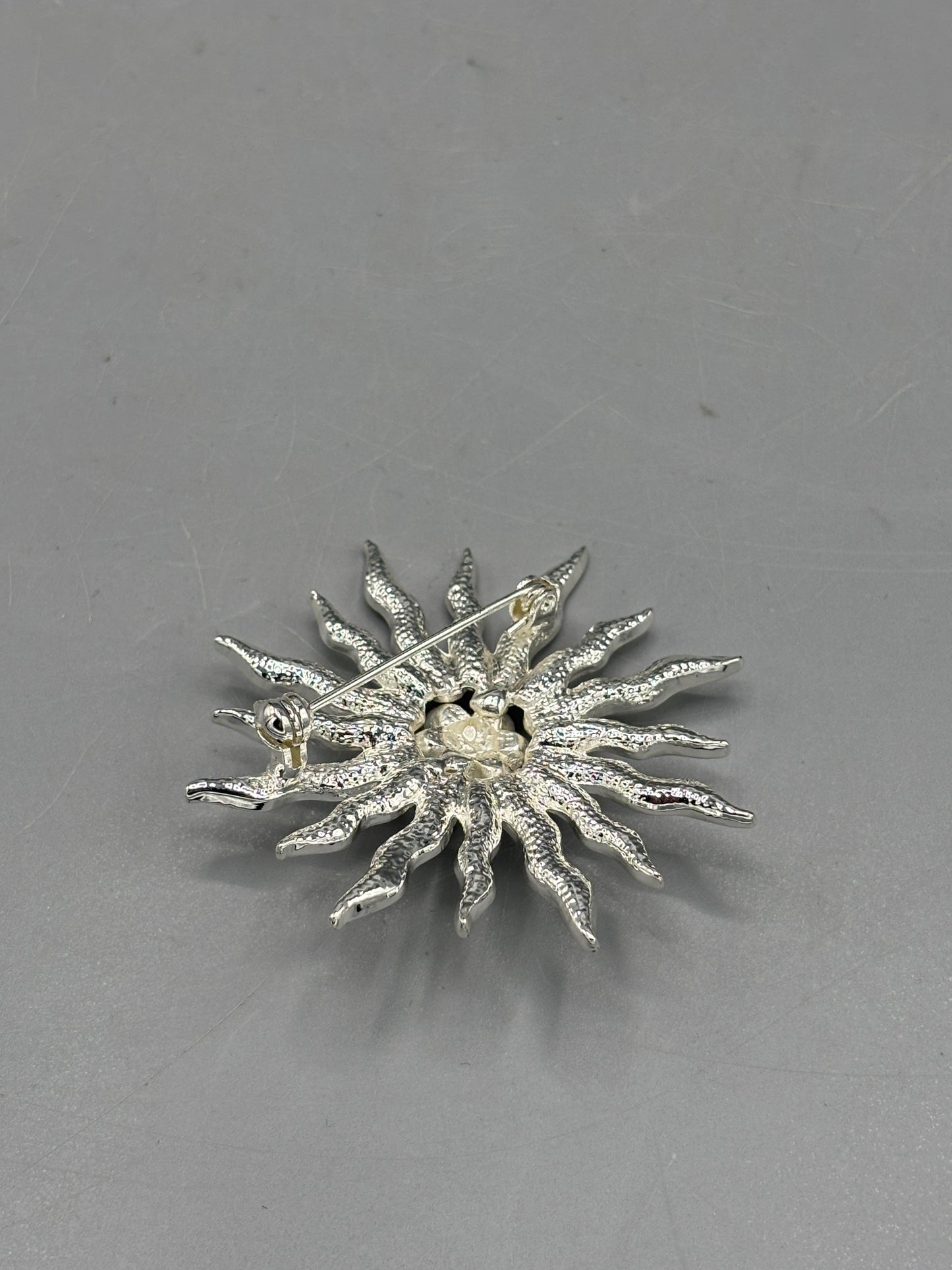 Vintage silver tone Rhinestone sunburst brooch