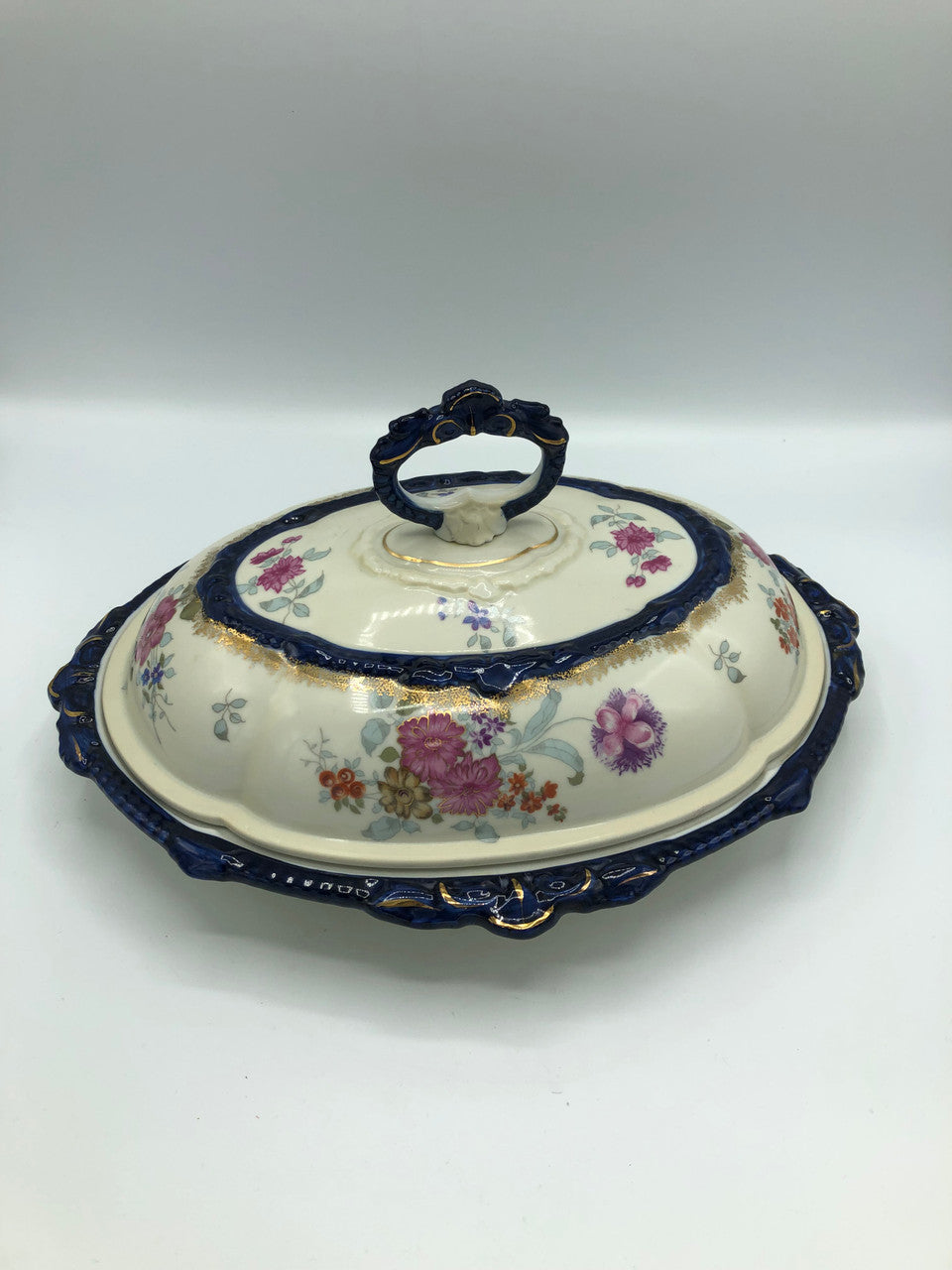 Signed Covered Dish Blue handle flowers