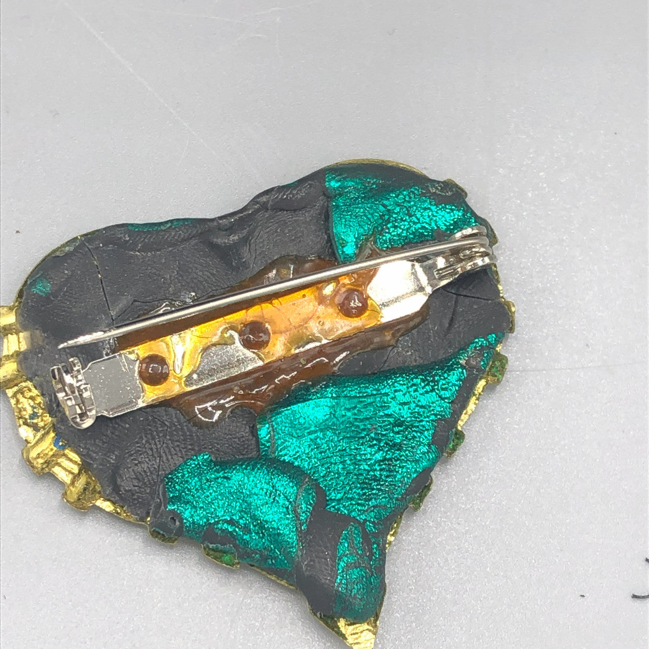 Gold tone handmade green heart brooch