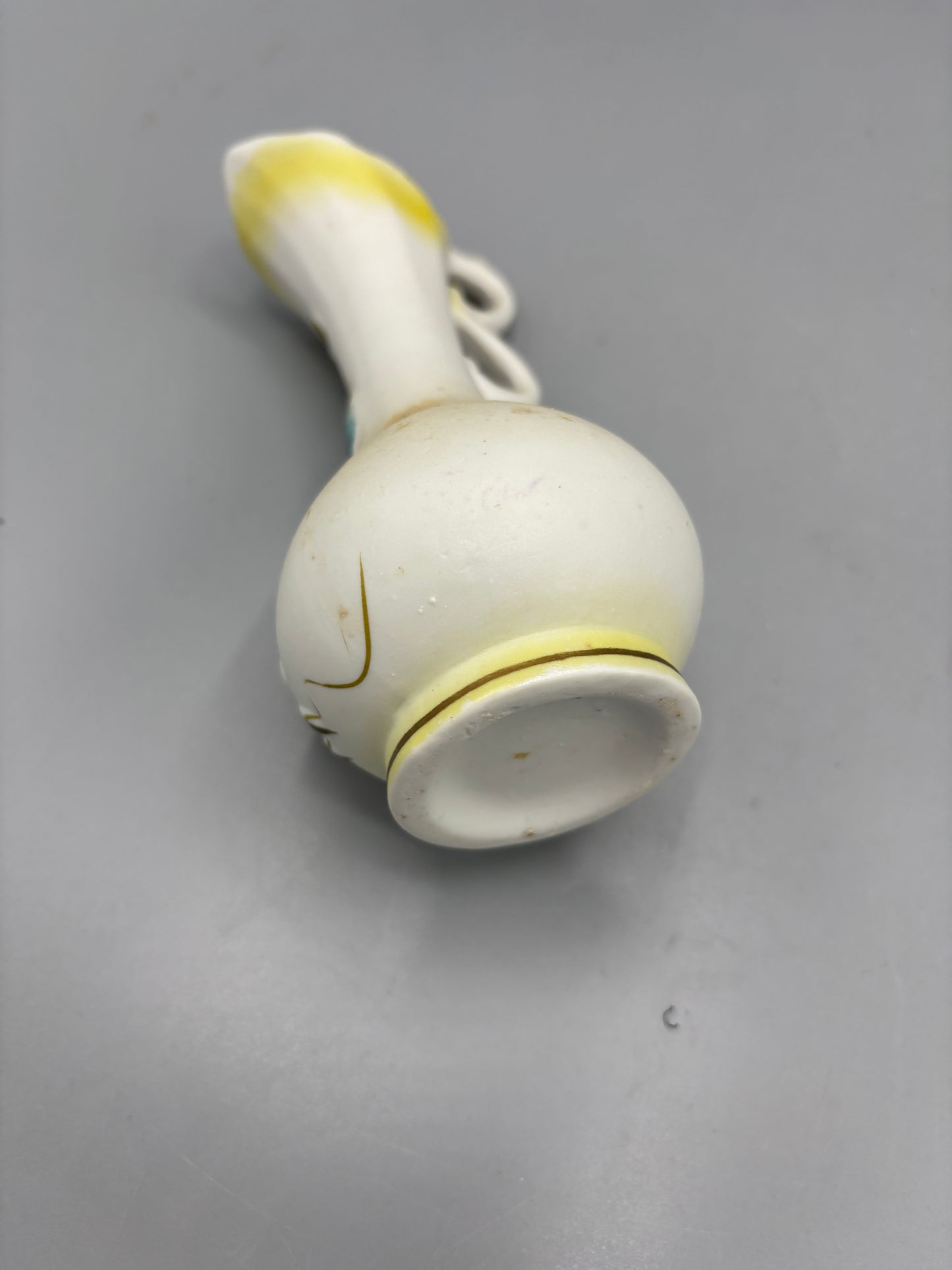 Vintage porcelain bisque pitcher with raised flowers