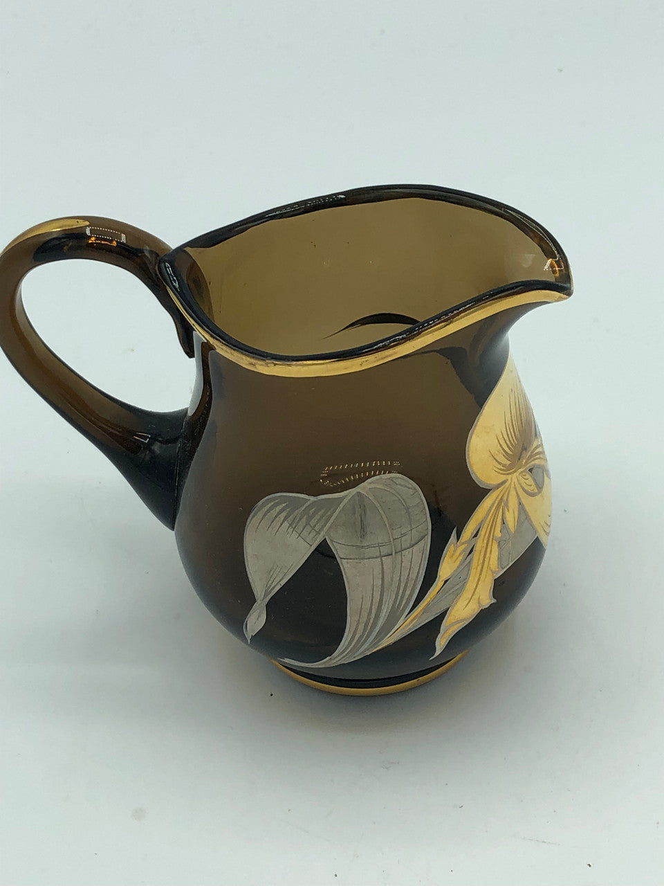 Brown glass creamer with gold & silver flowers