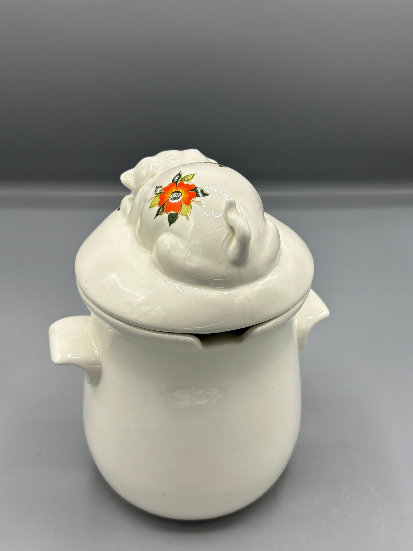 Ceramic orange flower pig canister