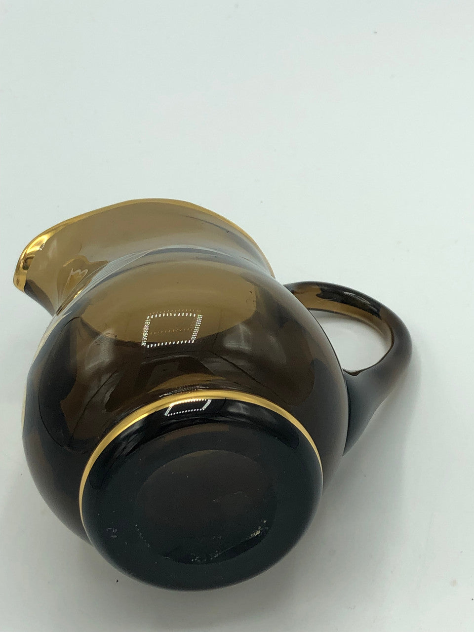 Brown glass creamer with gold & silver flowers