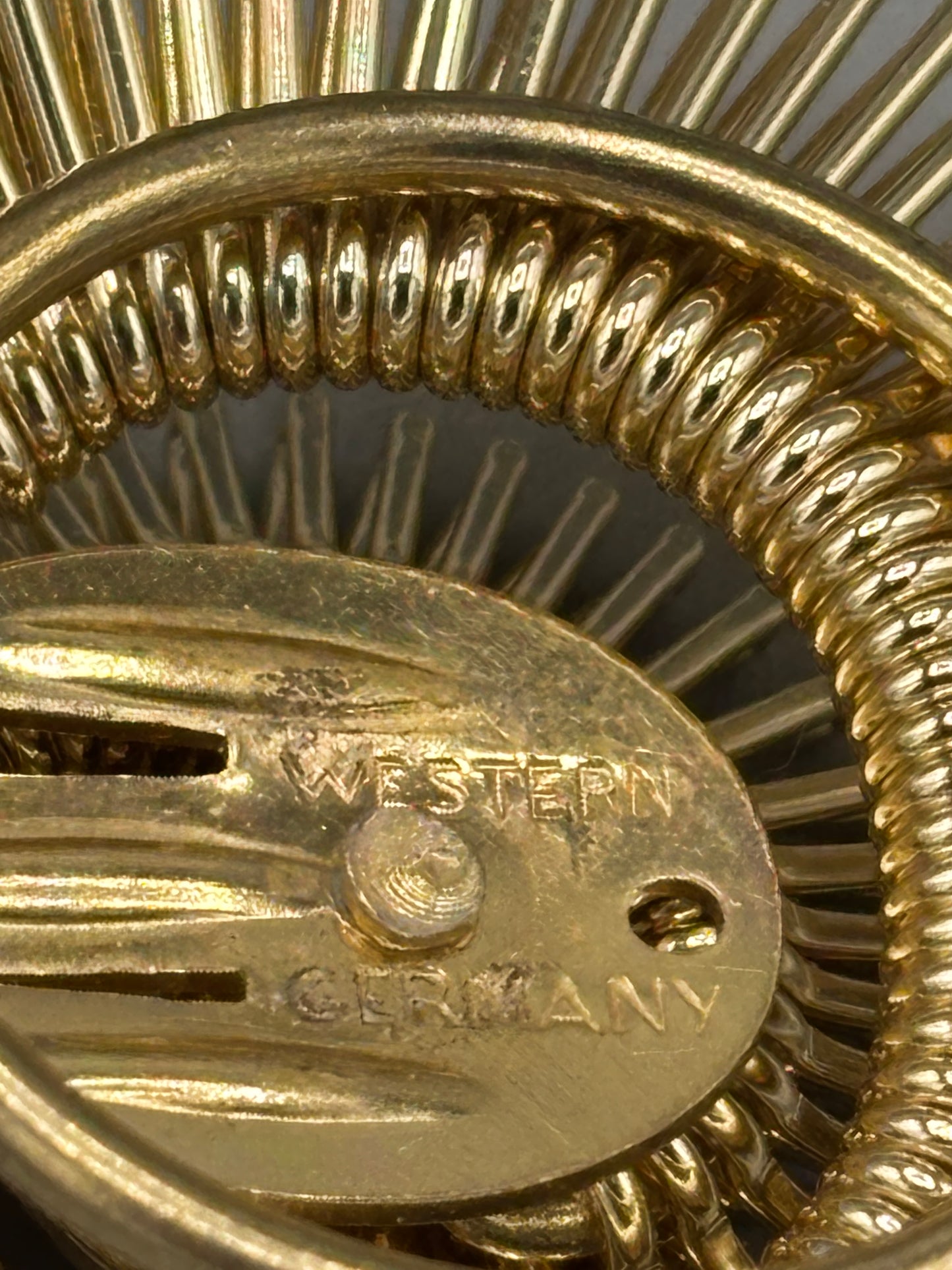 Vintage gold tone West Germany scarf clip spiral design
