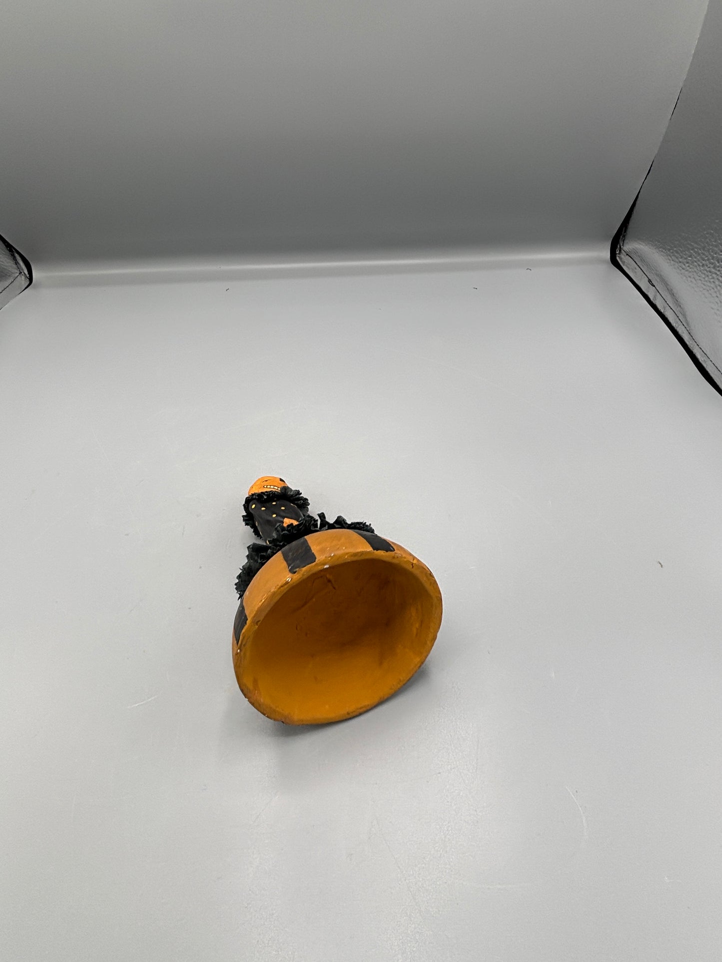 Standing Pumpkin head girl figure on striped base