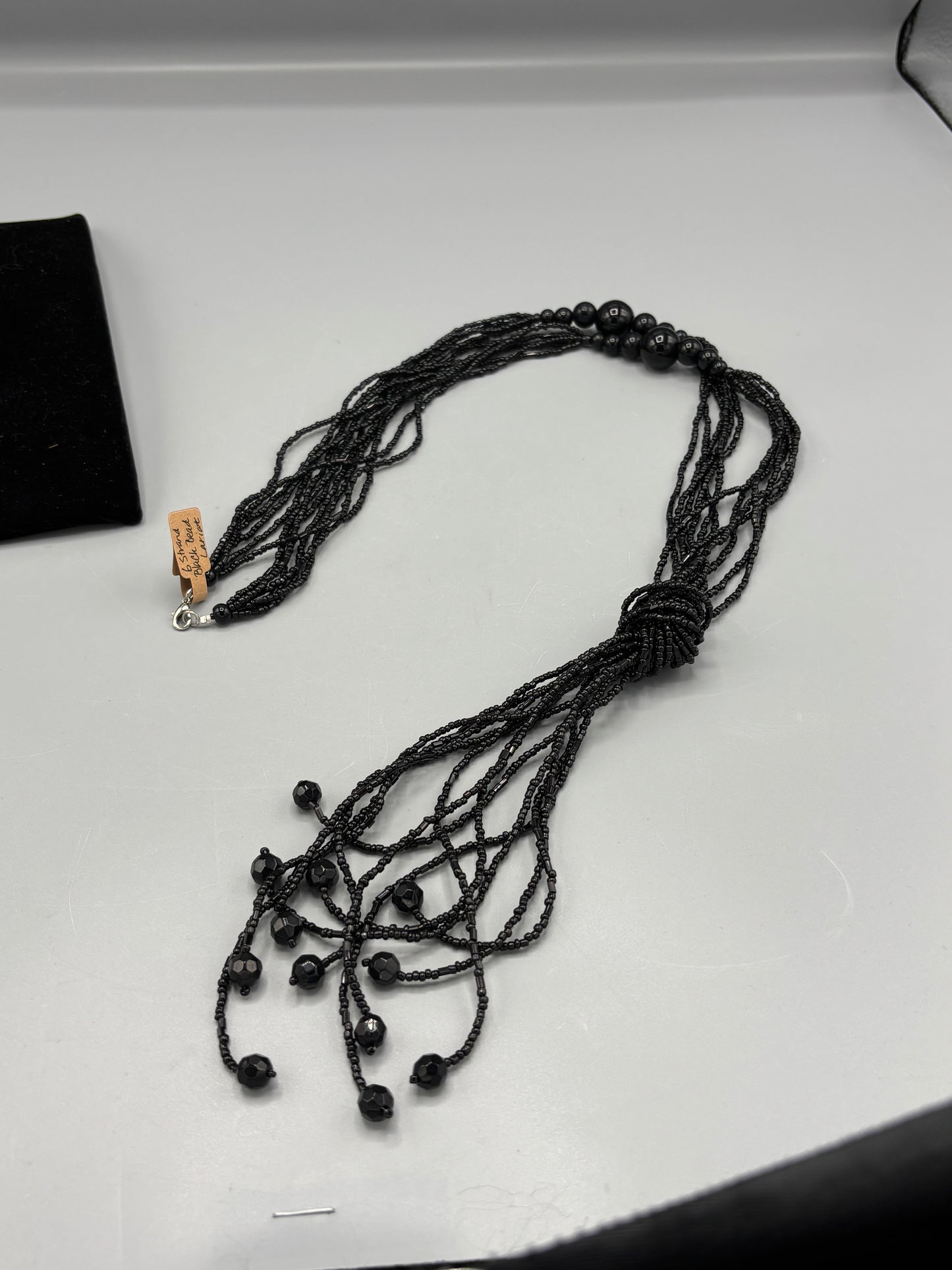 6 strand black bead Lariat