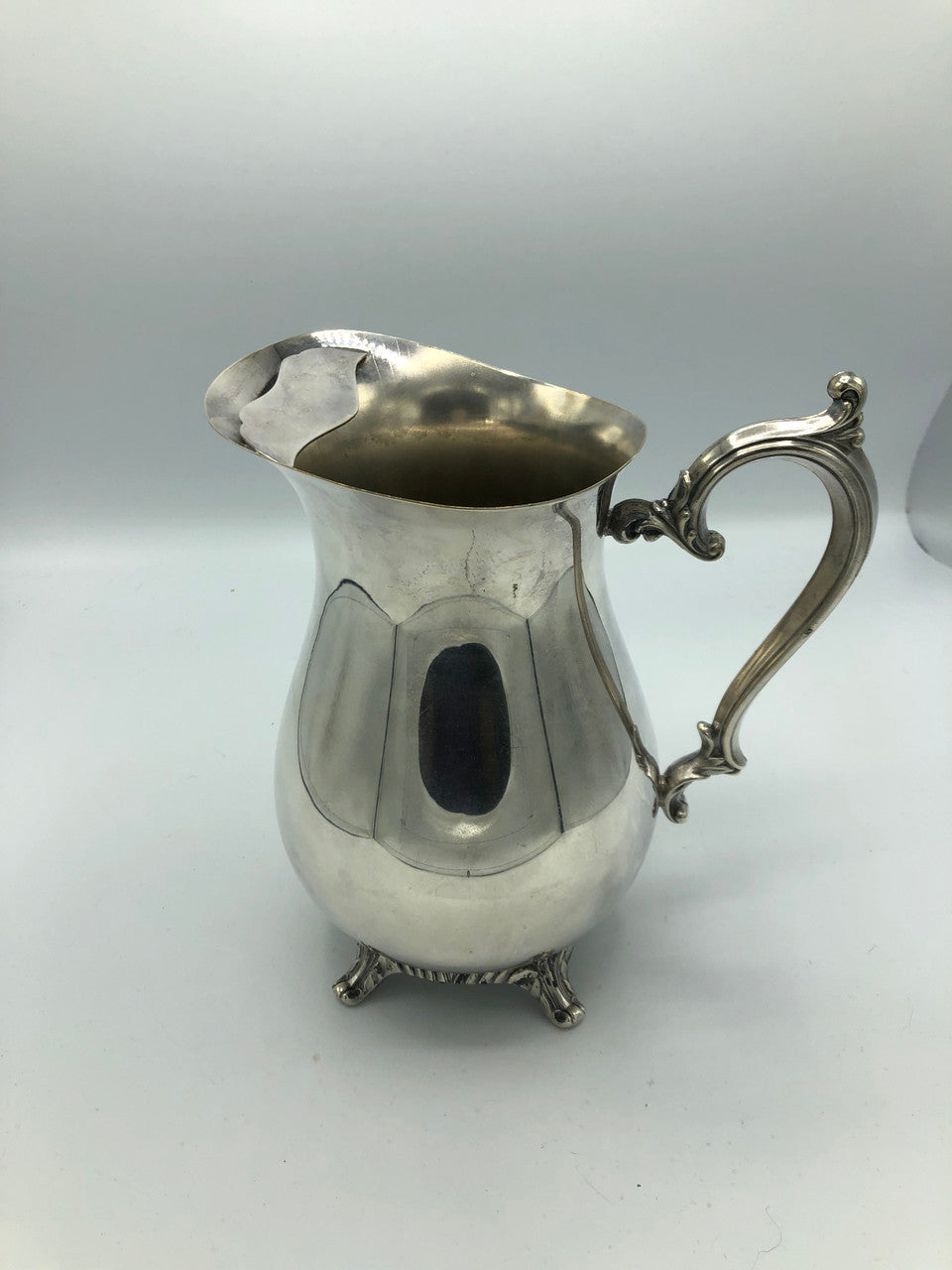 W.M. Rogers silver plated water pitcher with guard