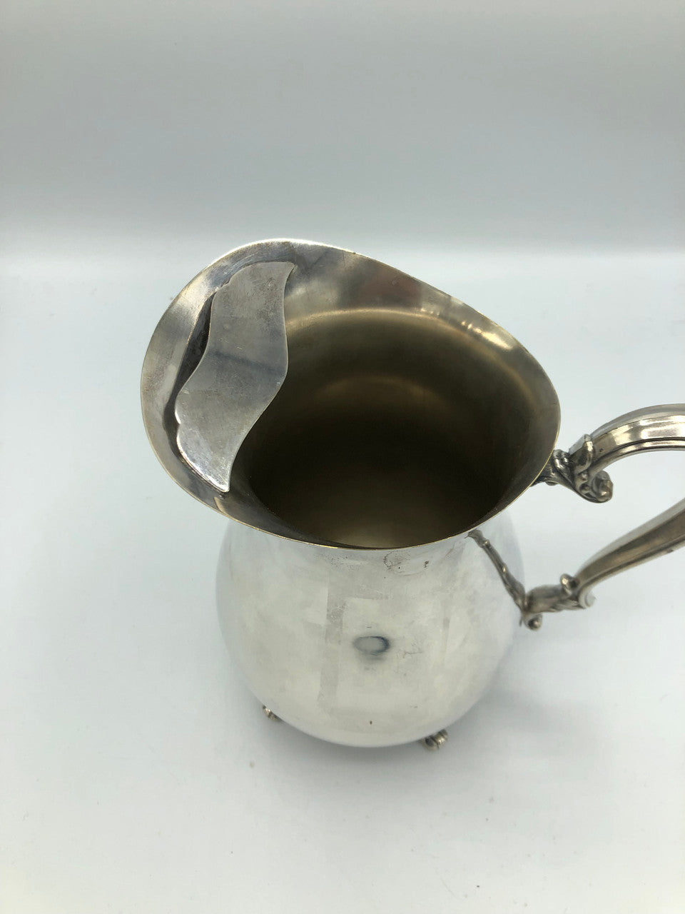 W.M. Rogers silver plated water pitcher with guard