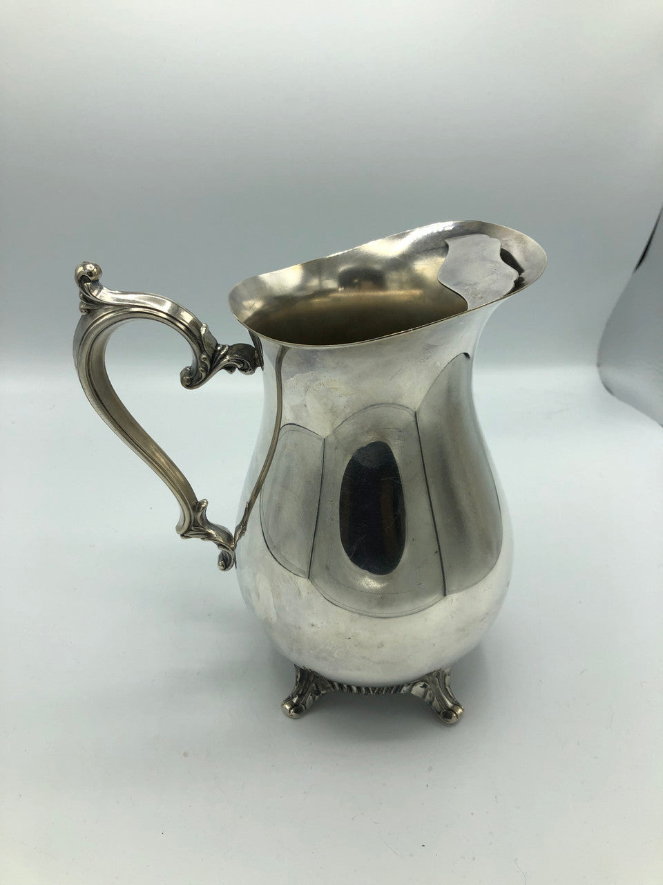 W.M. Rogers silver plated water pitcher with guard