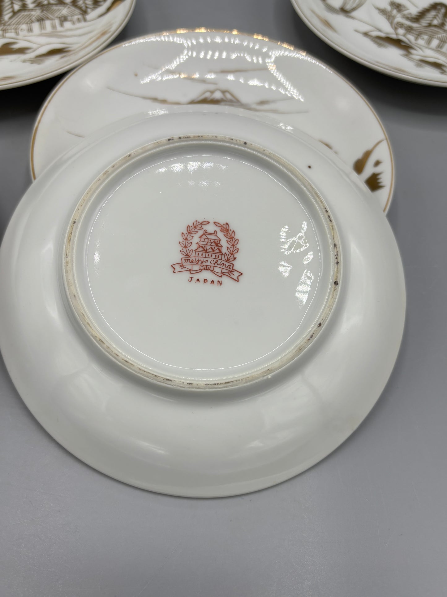 Japanese porcelain saucers with gold design