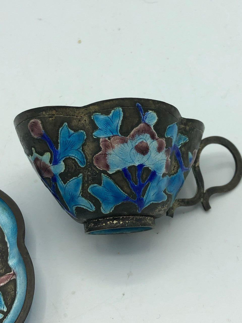 Antique copper enamel tea cup with saucer