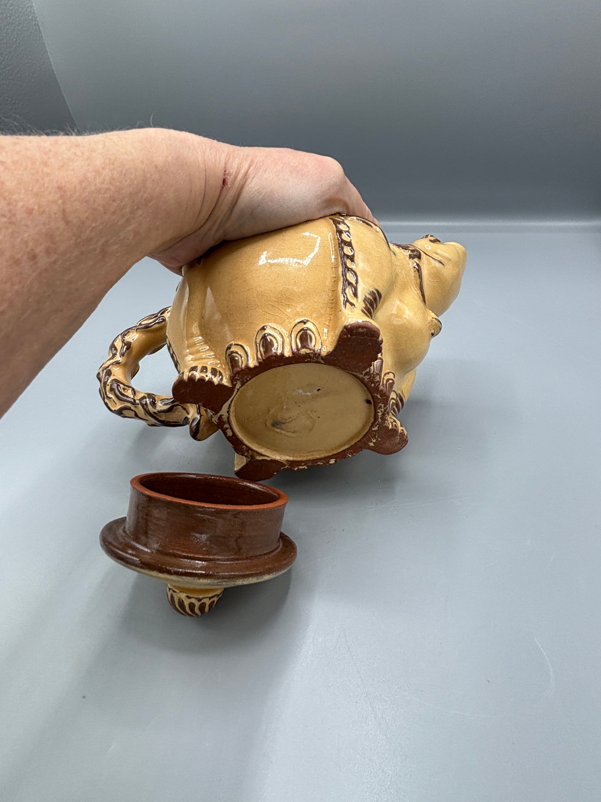Light Tan ceramic teapot with animal design