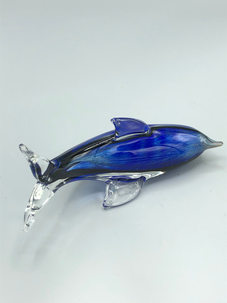 Blue glass dolphin figure