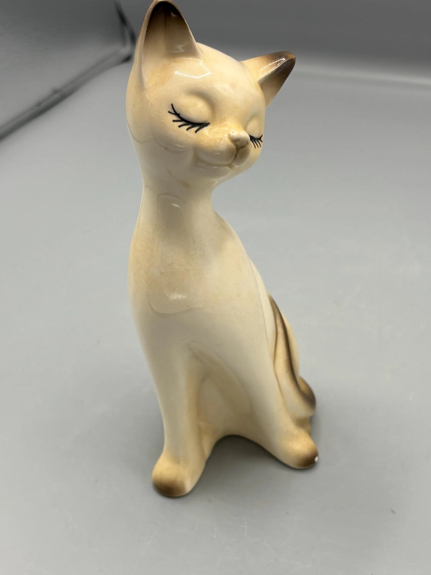 Napcoware ceramic ceramic sitting cat with painted eyelashes