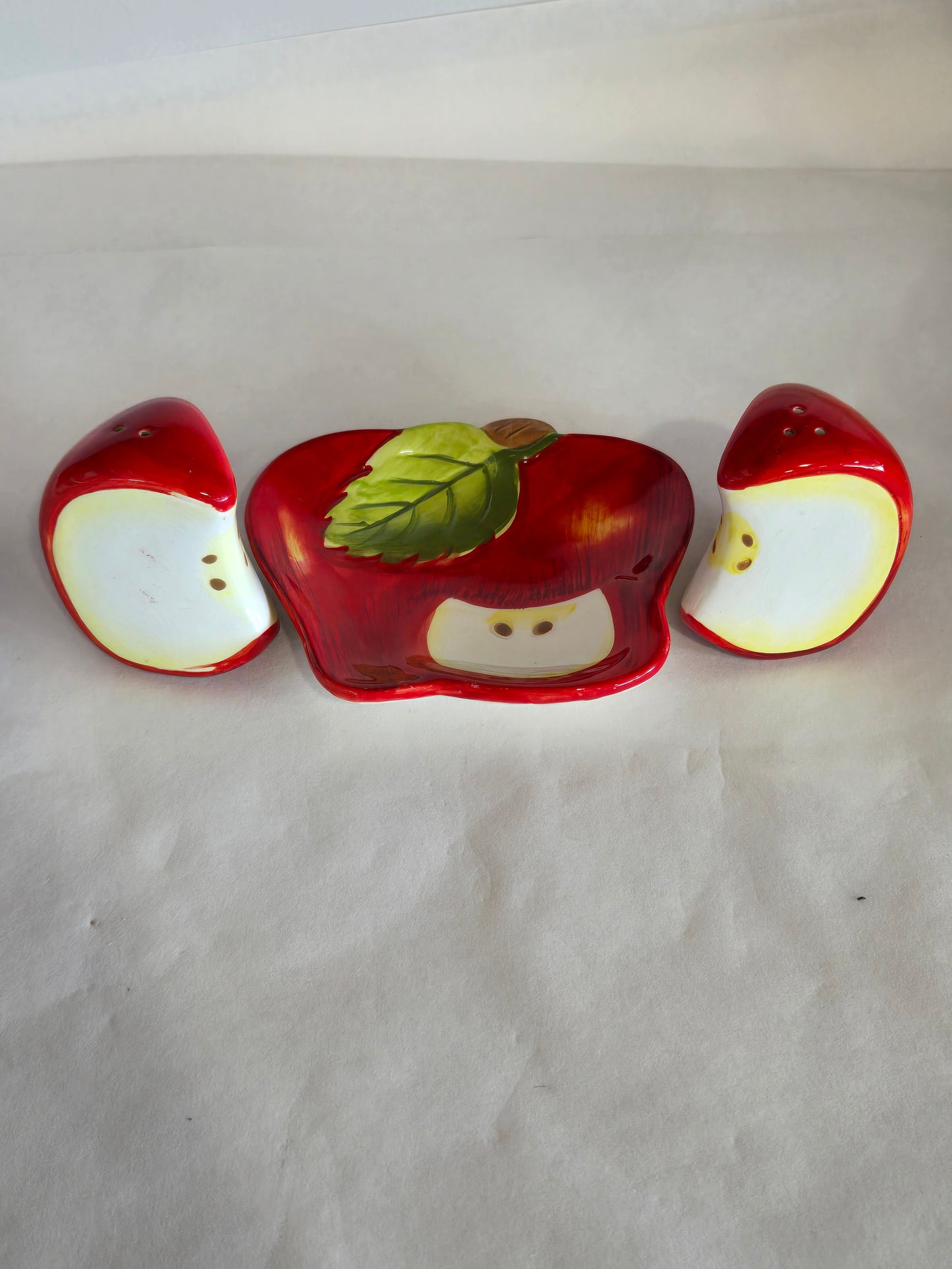 ceramic salt and pepper apple slices set on matching tray