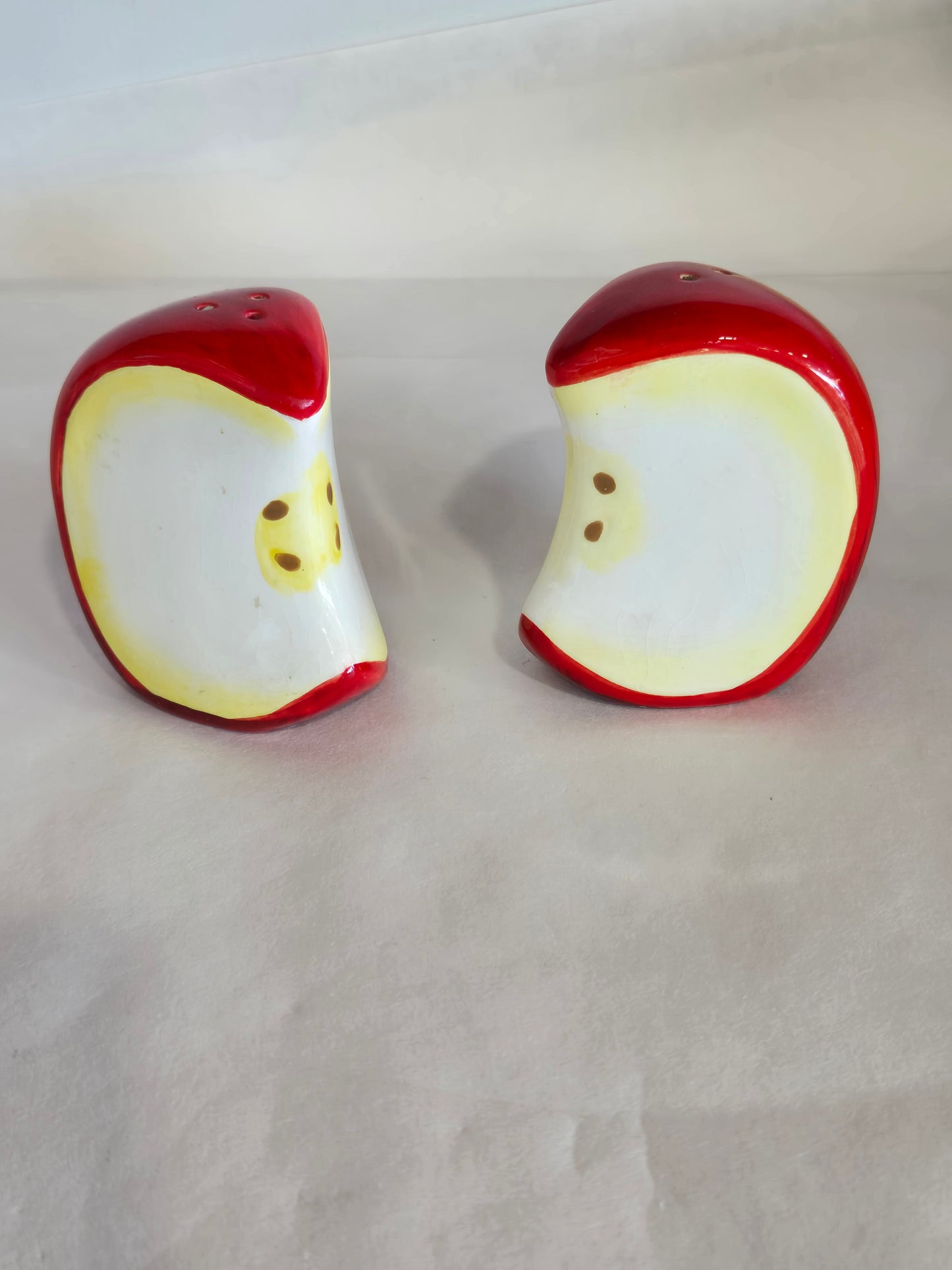 ceramic salt and pepper apple slices set on matching tray
