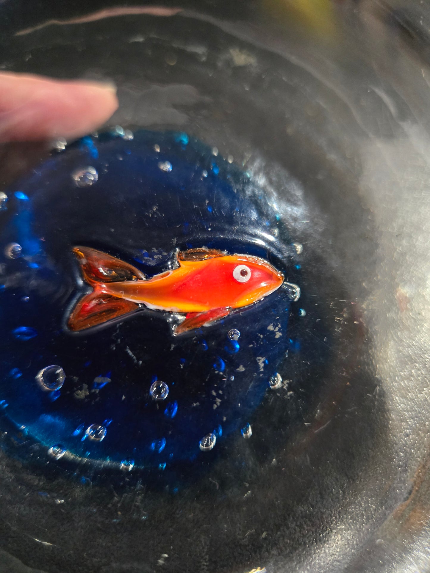 Clear glass bowl with orange fish & bubbles
