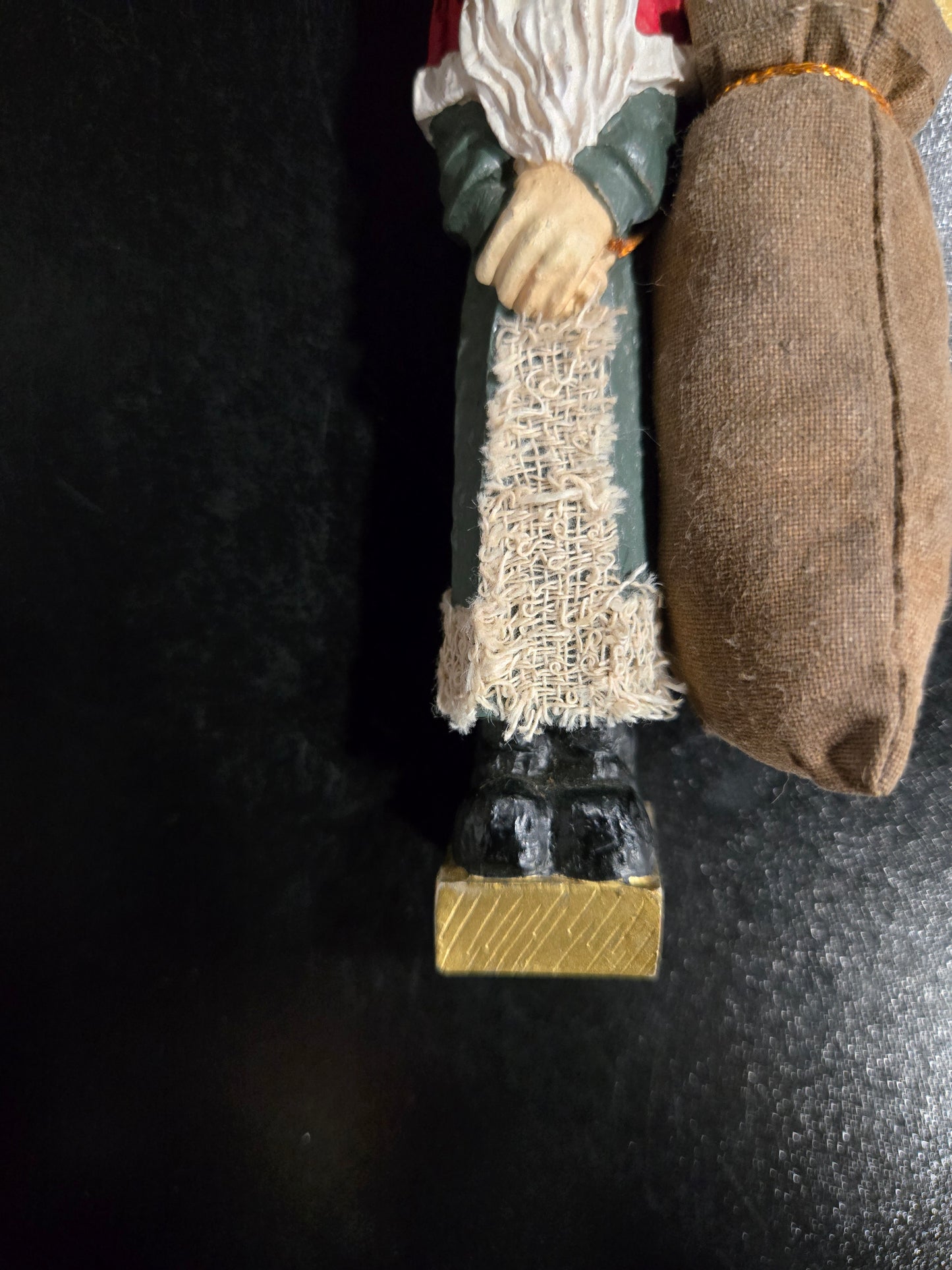 Resin Santa Claus holding big pin cushion