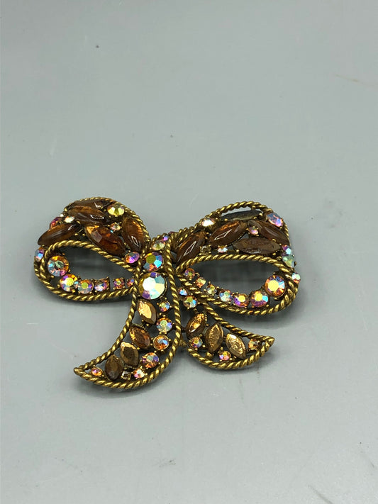 Multi colored stone bow brooch