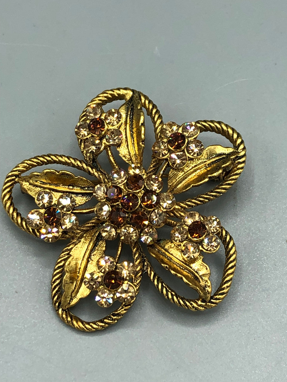 Gold tone  crystal flower brooch