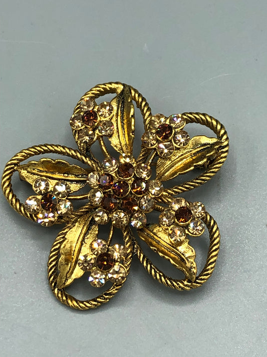 Gold tone  crystal flower brooch