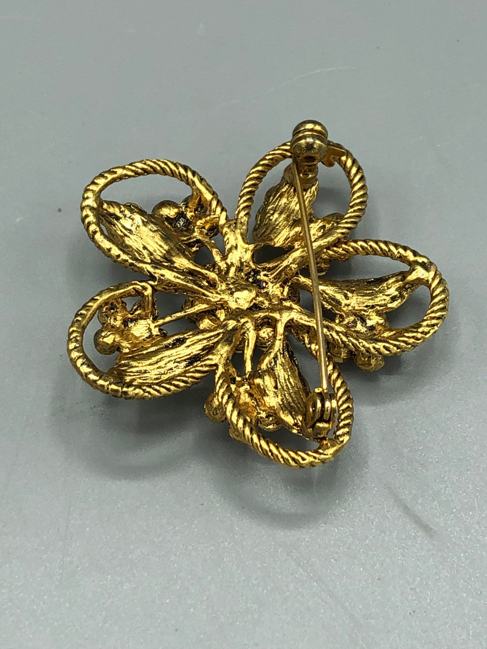 Gold tone  crystal flower brooch