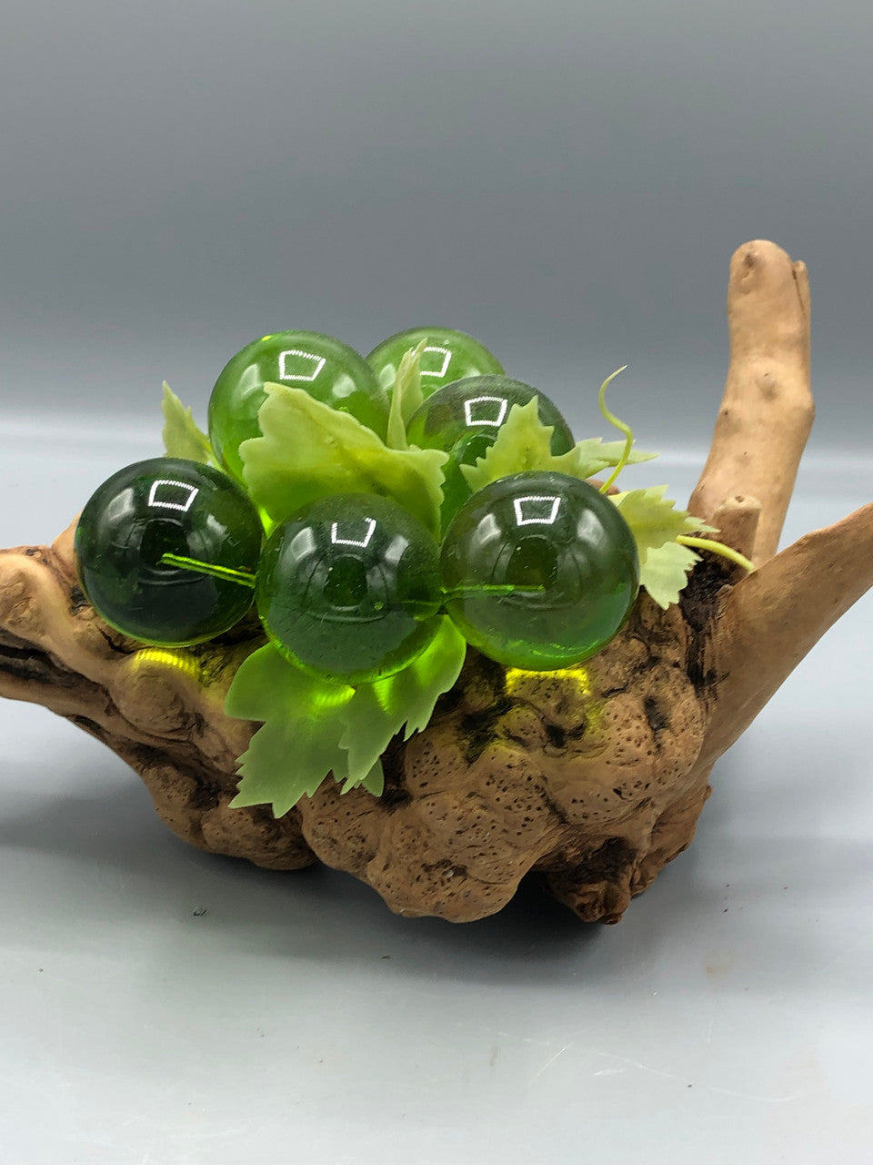 6 Cluster green grapes on wood