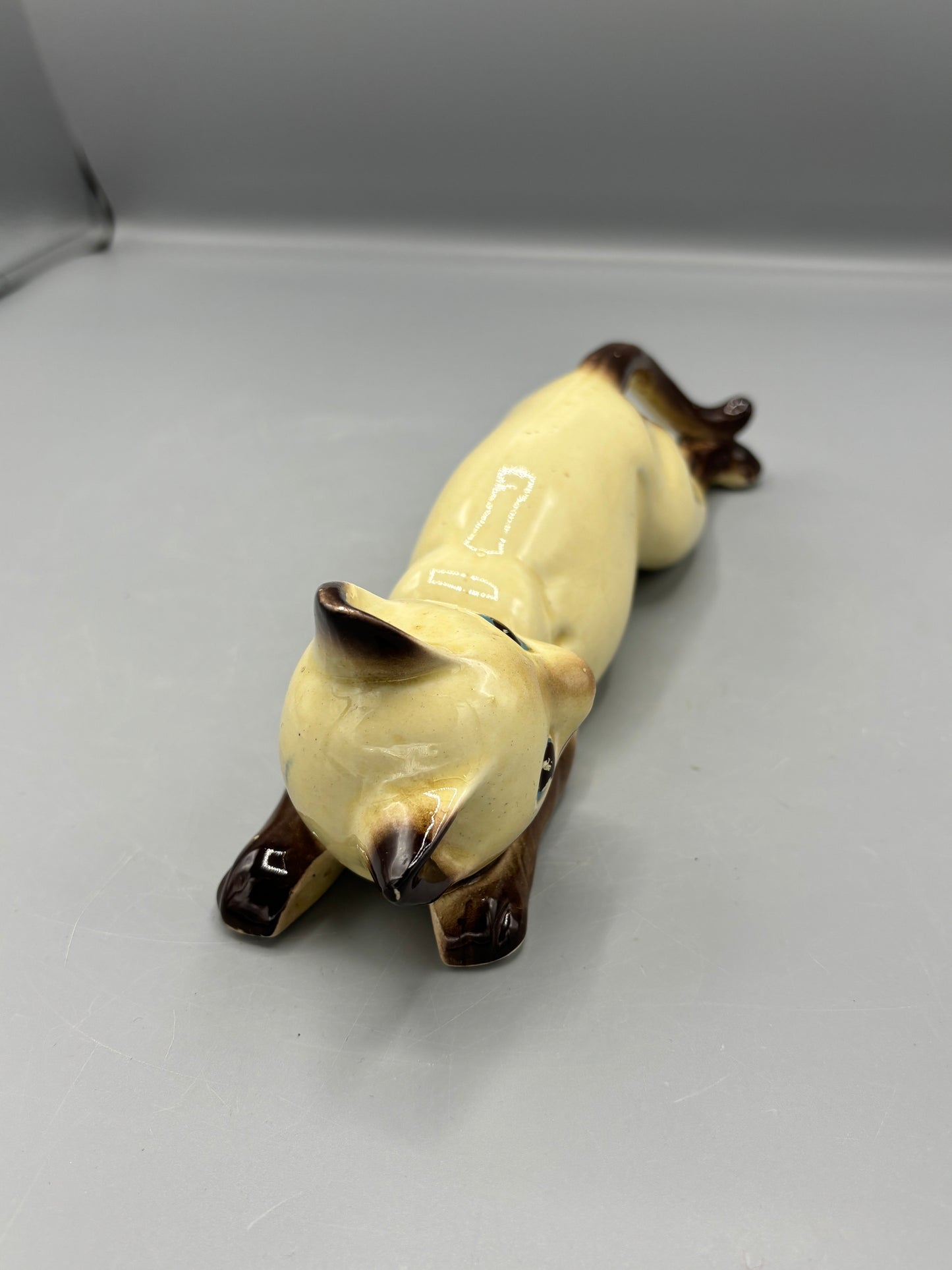 Vintage ceramic reclining Siamese cat