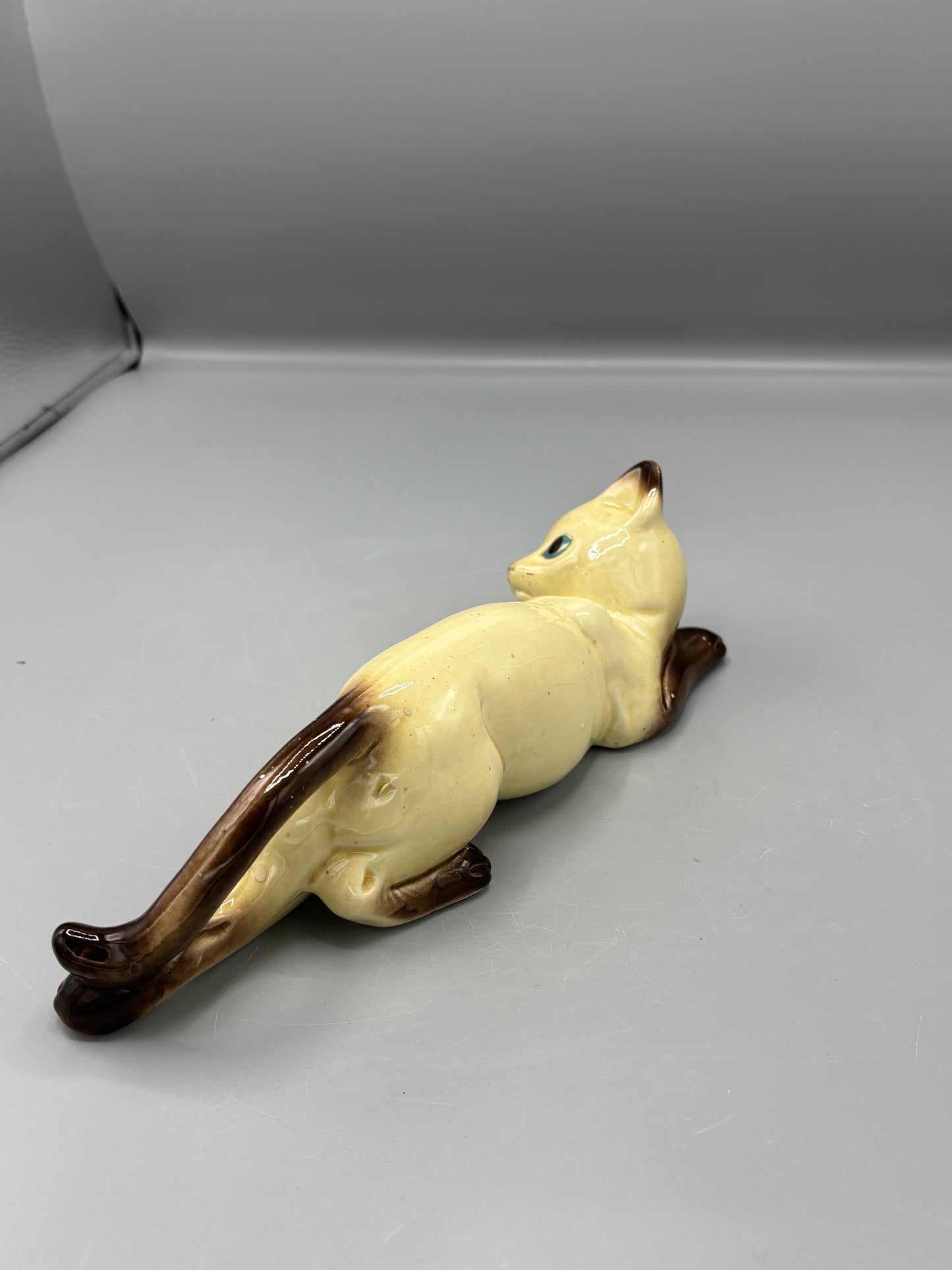 Vintage ceramic reclining Siamese cat