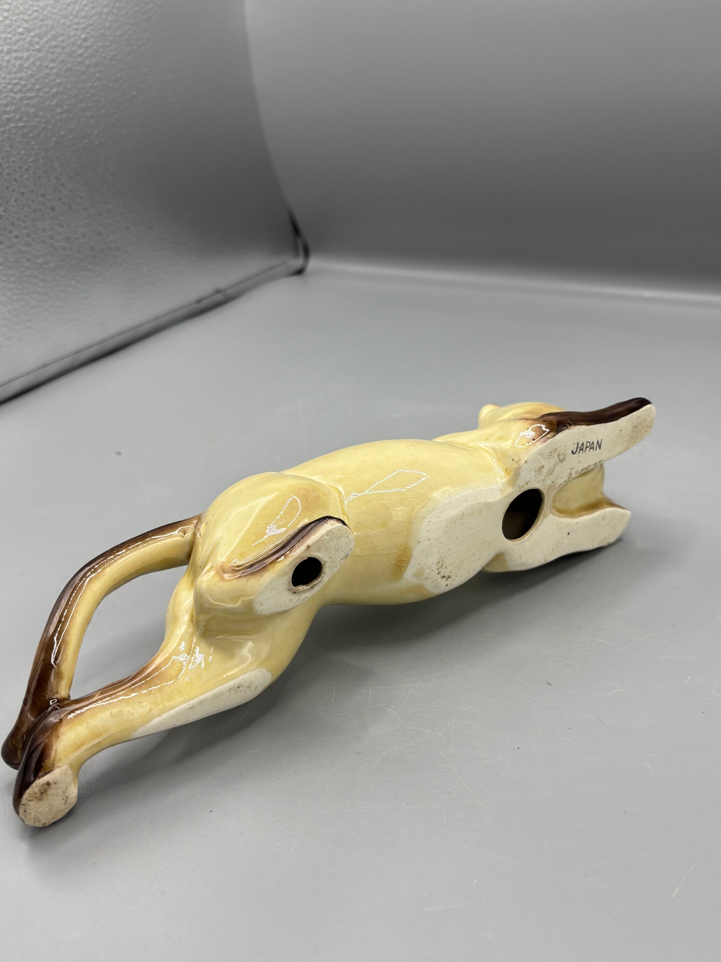 Vintage ceramic reclining Siamese cat