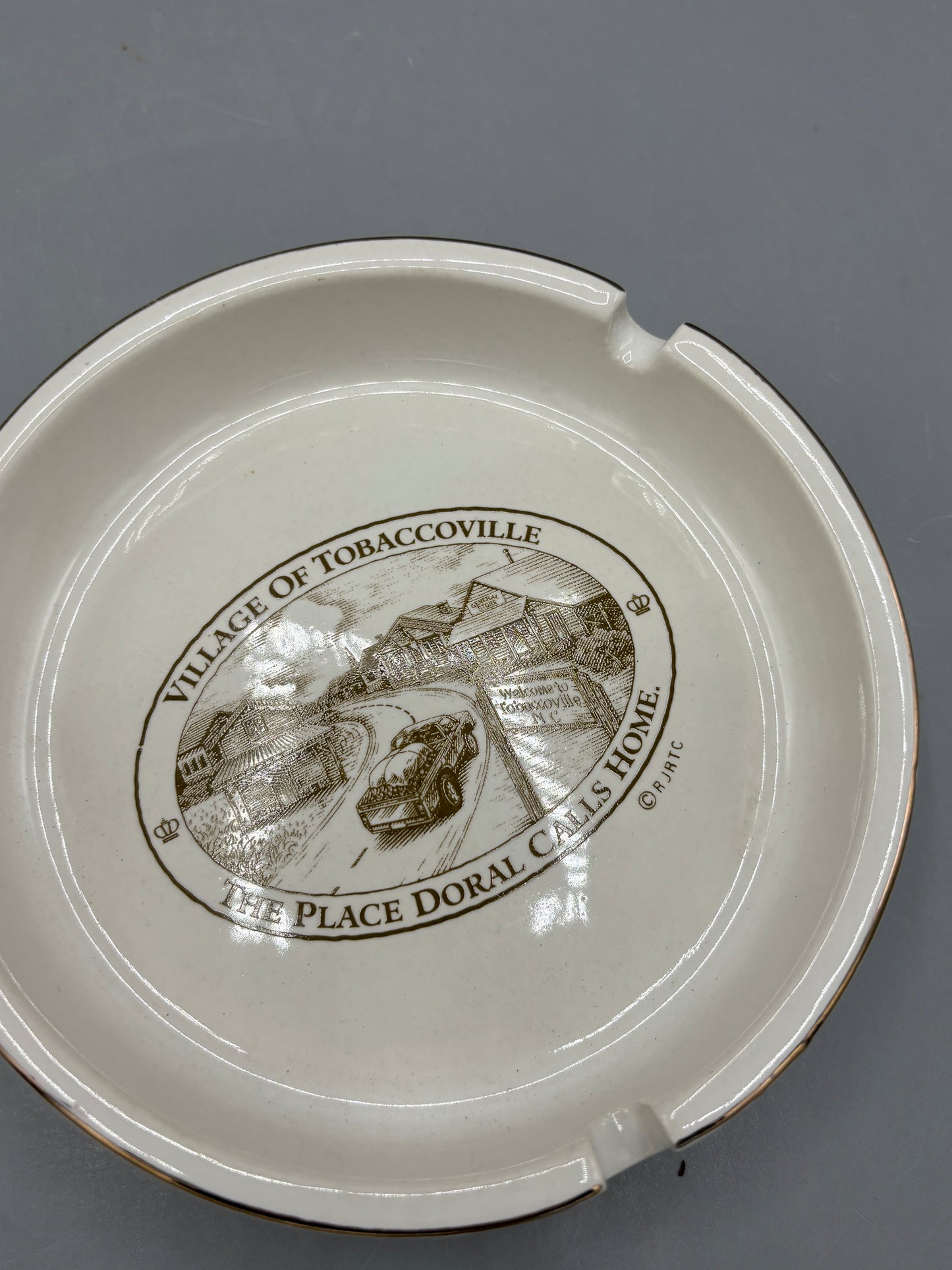 Vintage Ceramic ashtray featuring Village of Tobbaccoville