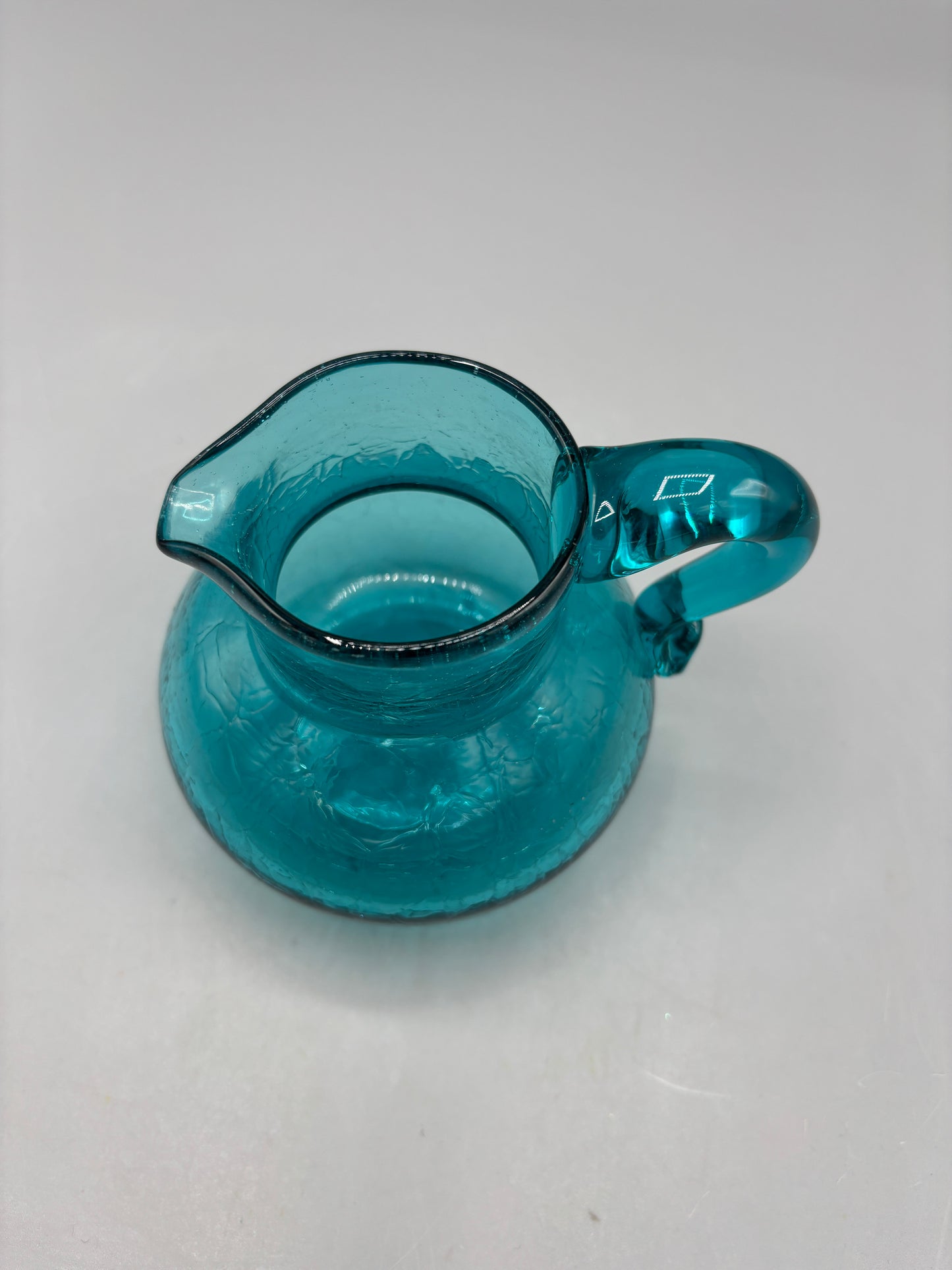 Teal hand blown textured glass pitcher